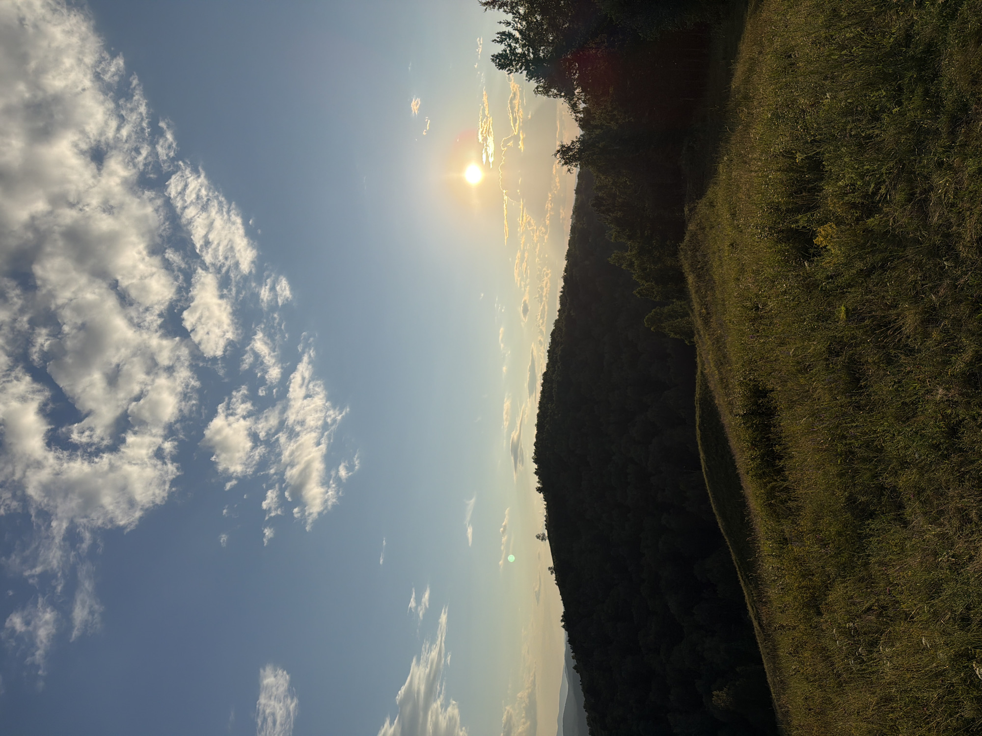 Sunset over Krasnoyarsk's forested hills and valley