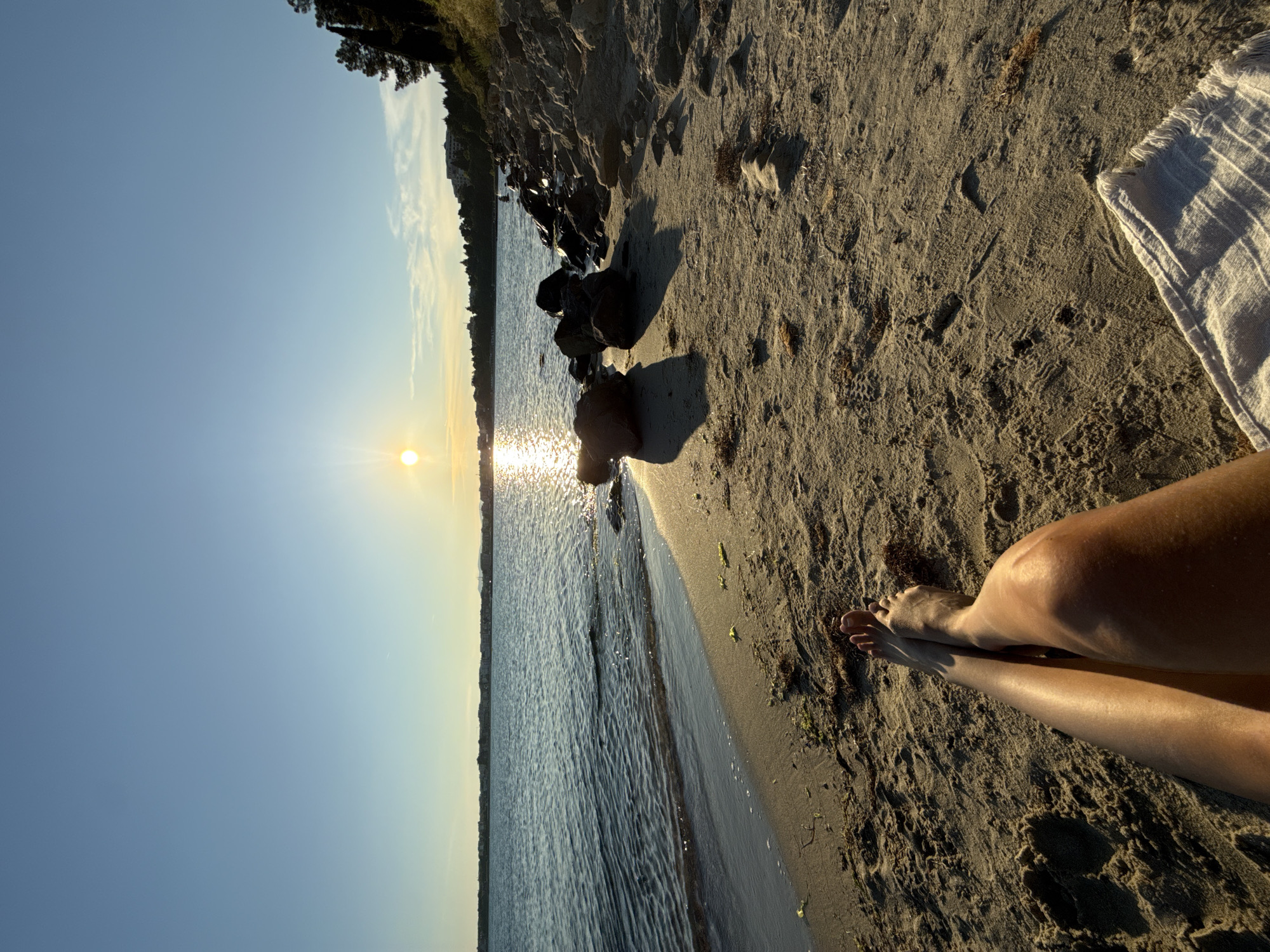 Woman enjoys sunset beach session in Nesebar, Bulgaria
