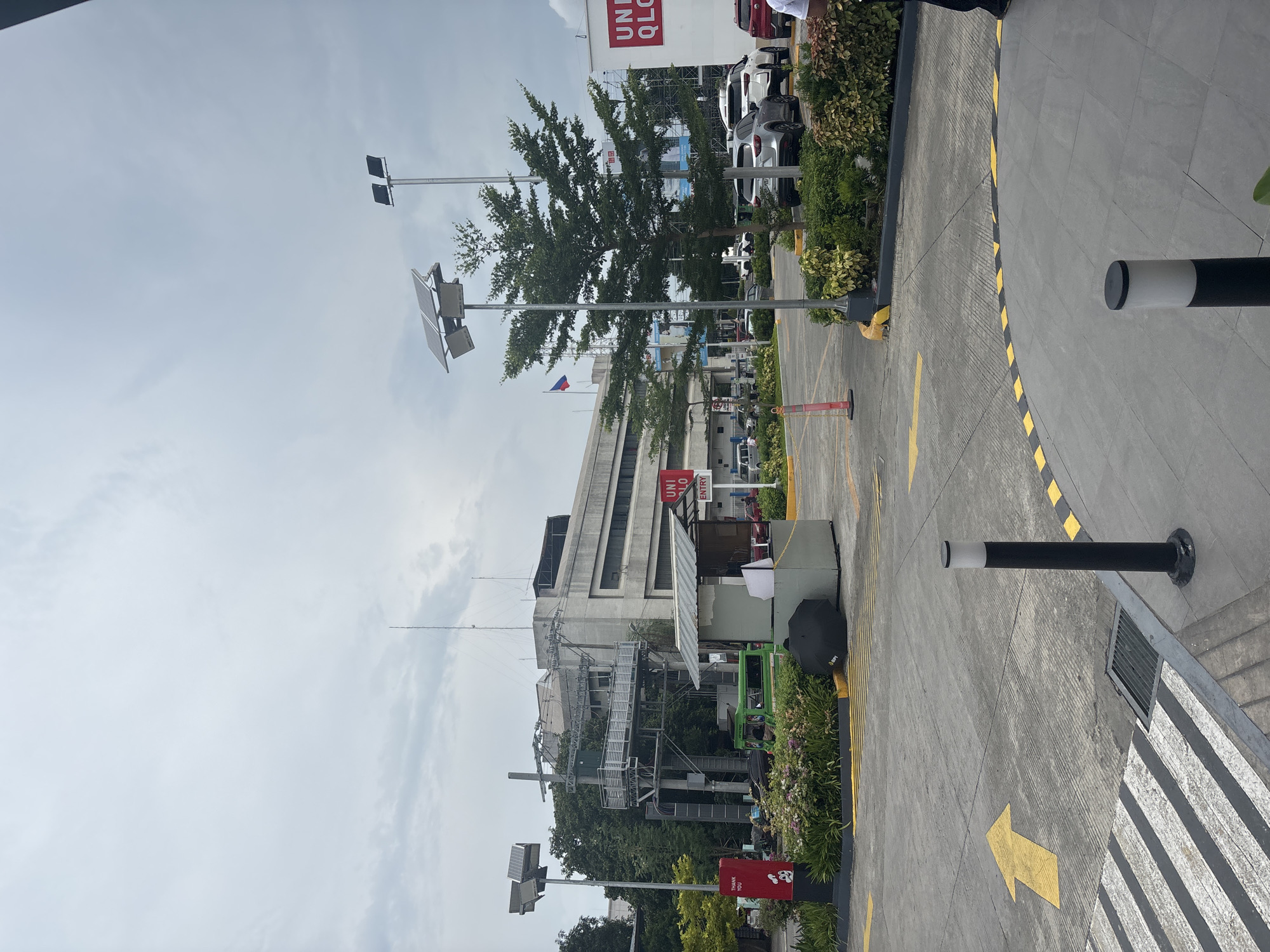 Street-level look at a Jollibee and surrounding retail strip in Davao City