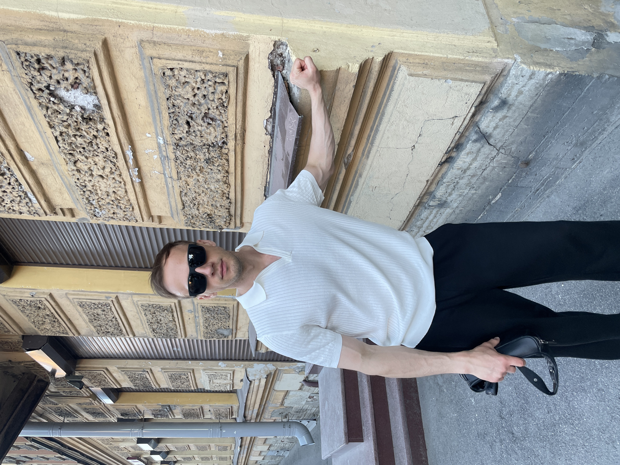 Man in white polo observed walking Saint Petersburg streets