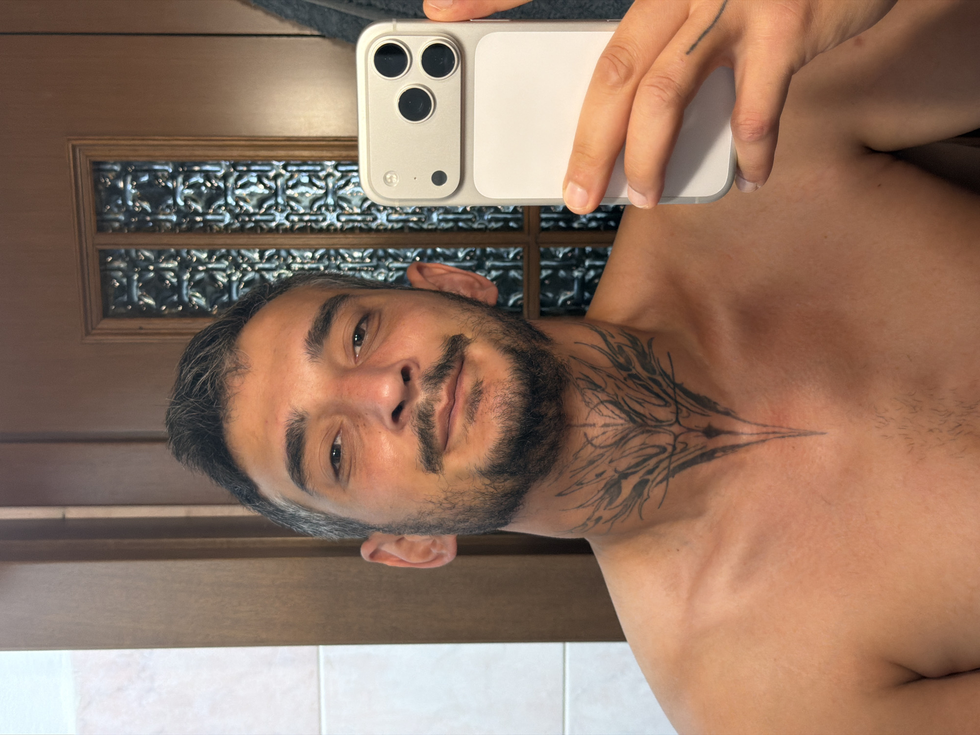 Milan apartment: bathroom selfie and pet tanks on display