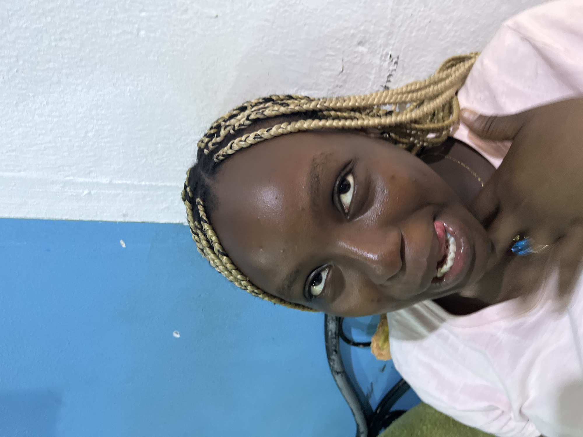 Woman poses for photos indoors during brief afternoon session