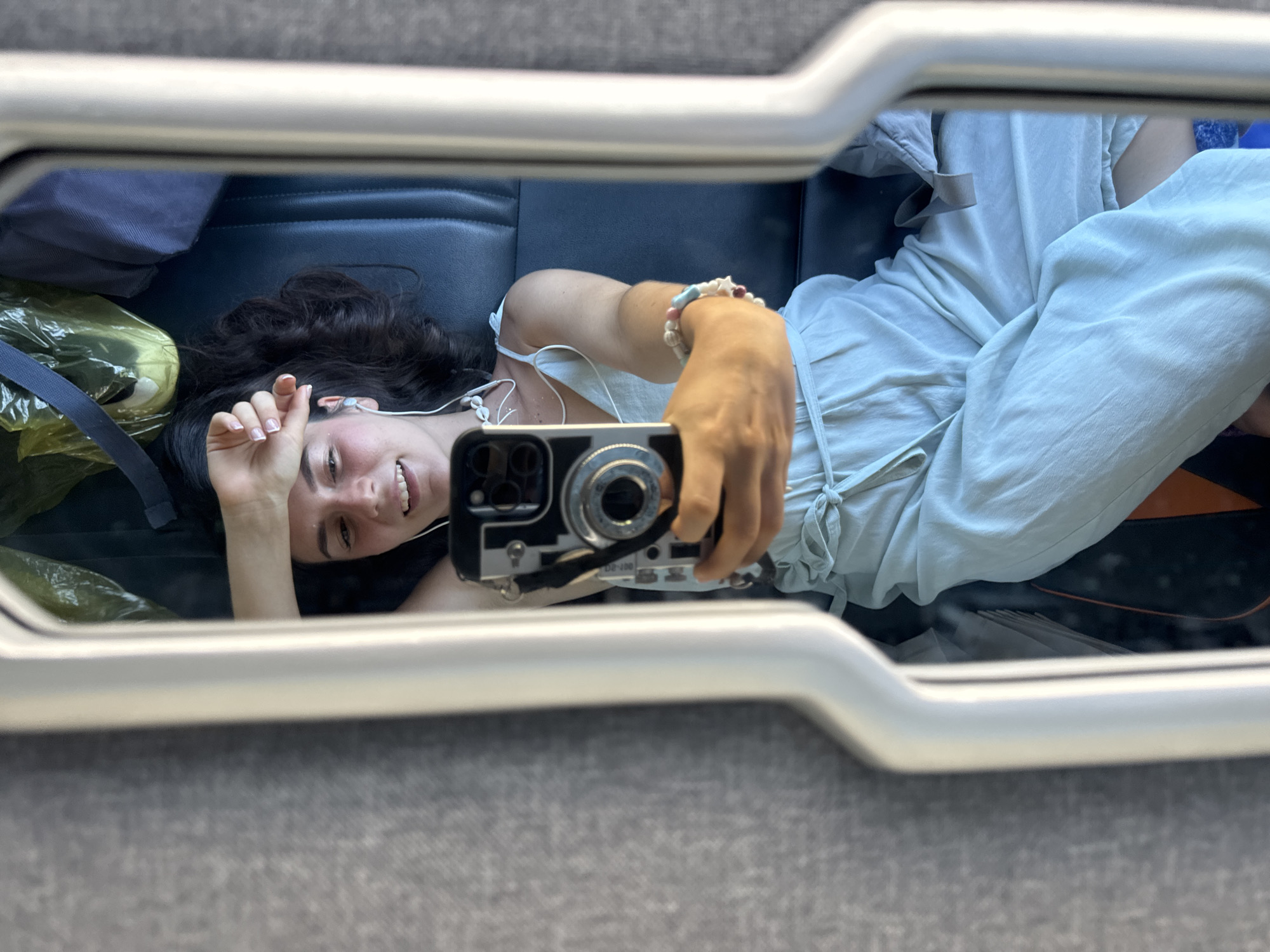 Woman takes mirror selfie on Vietnam public transport