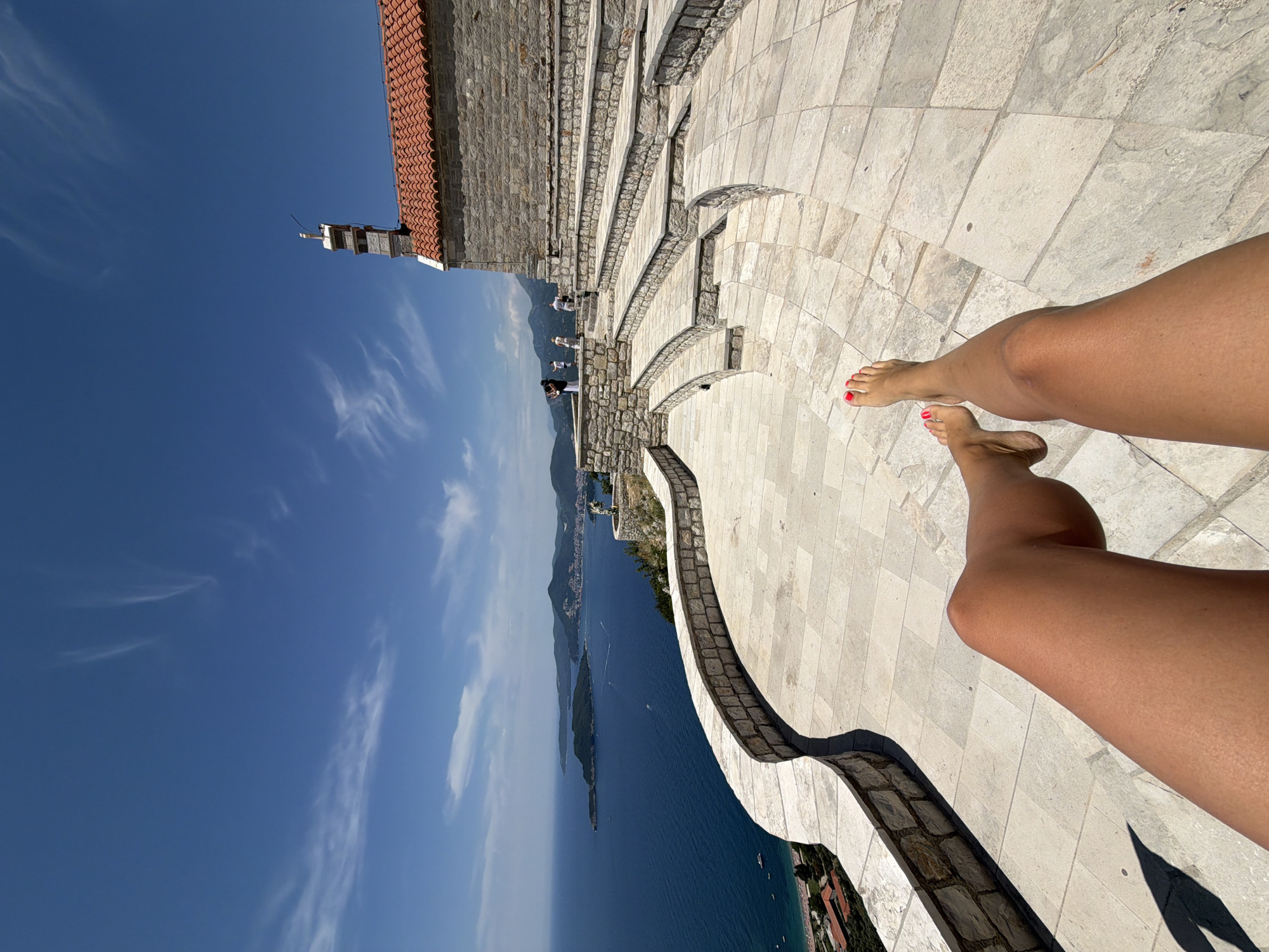 Wedding ceremony held on Sveti Stefan clifftop overlooking Adriatic Sea
