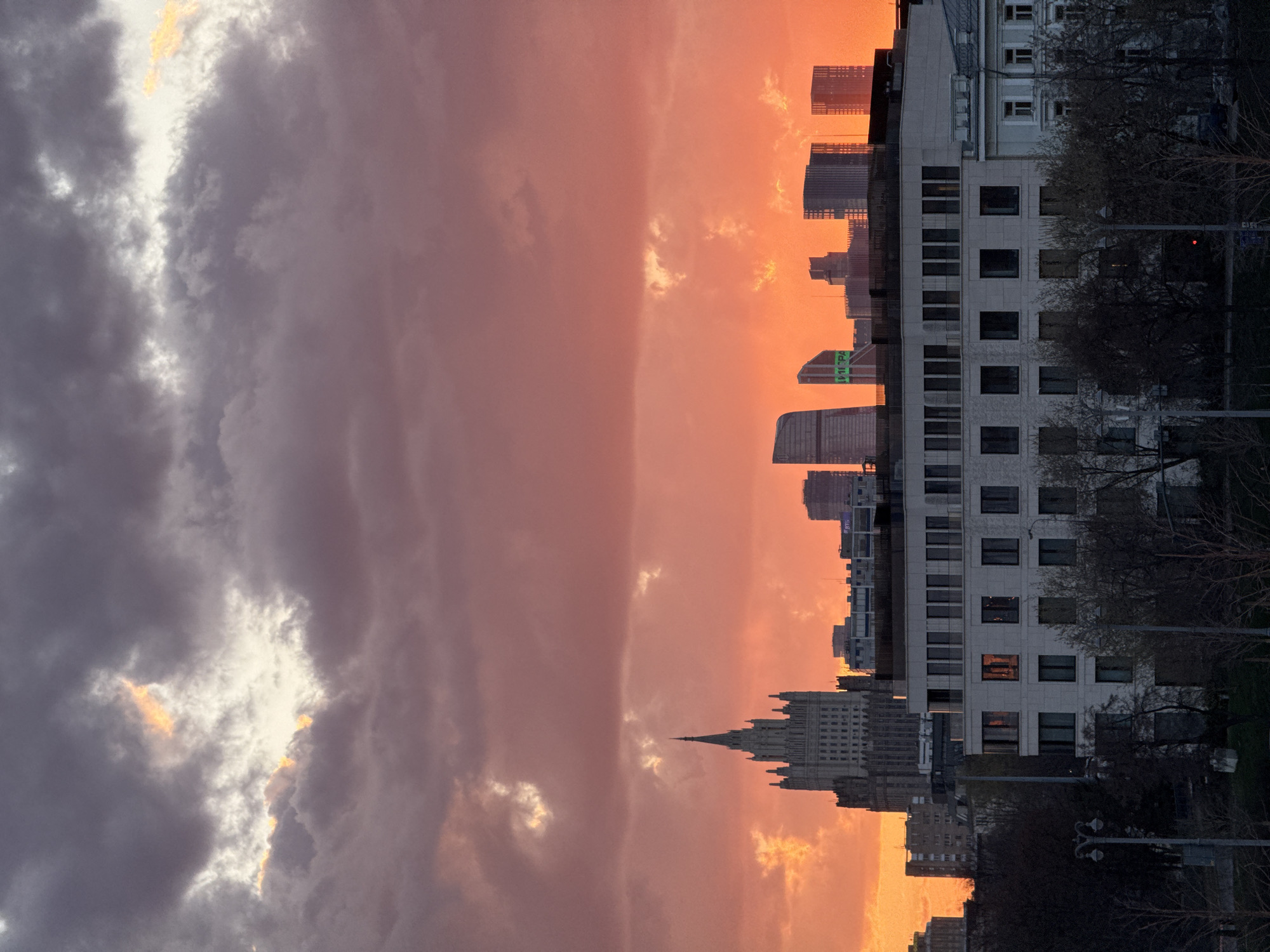 Sunset cityscape documented with dramatic sky color transition