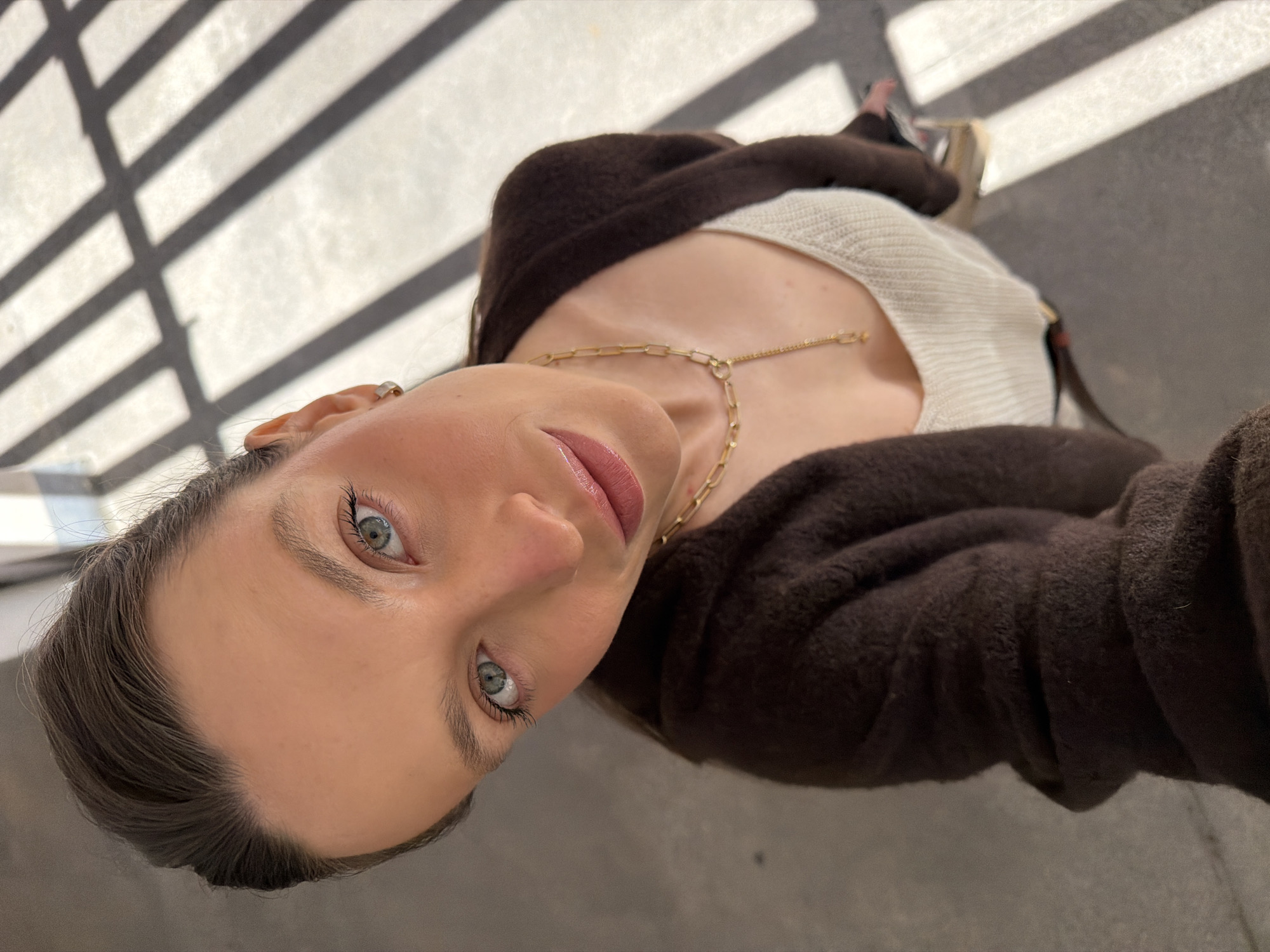 Woman takes selfies in indoor locations around Budva