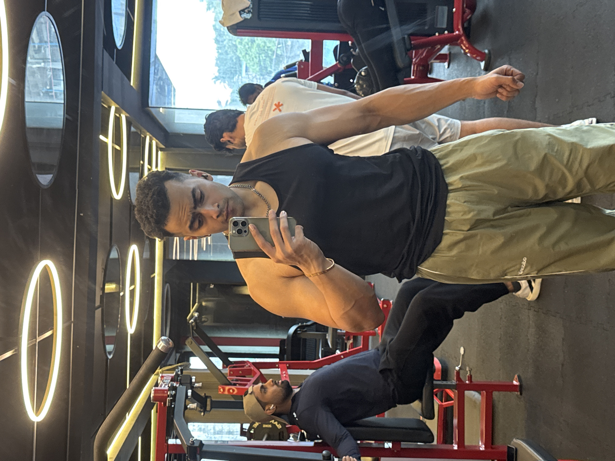 Late-night gym session in Kolkata, selfies and weight machines.