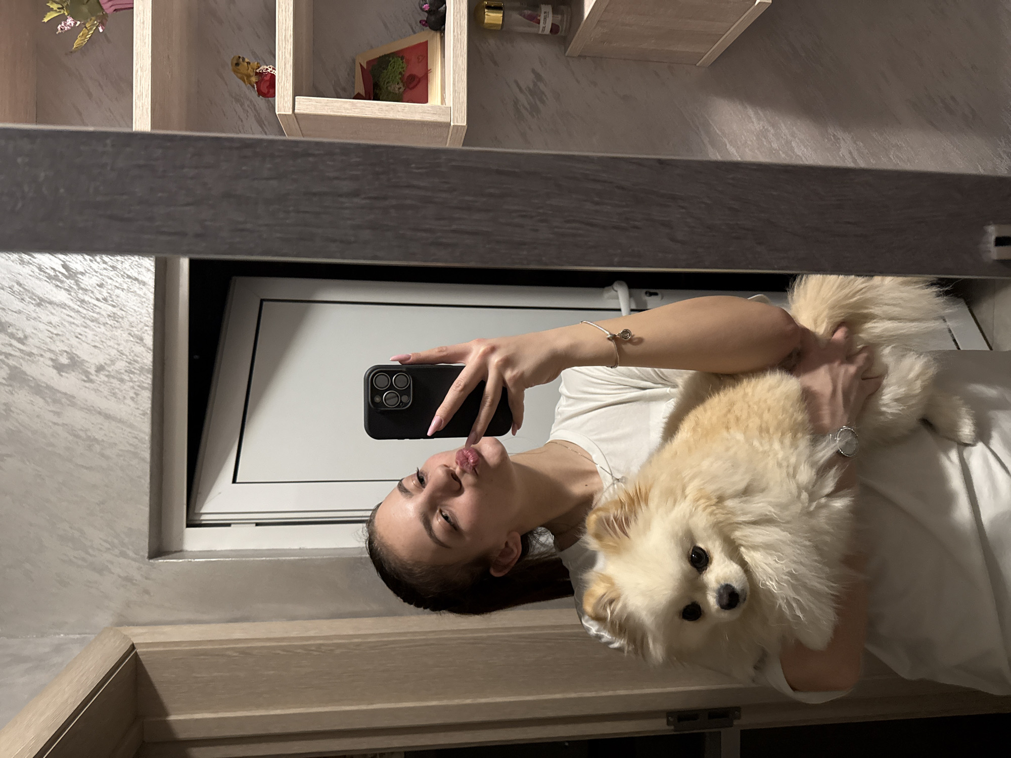 Woman takes selfie with Pomeranian dog in Bulgaria