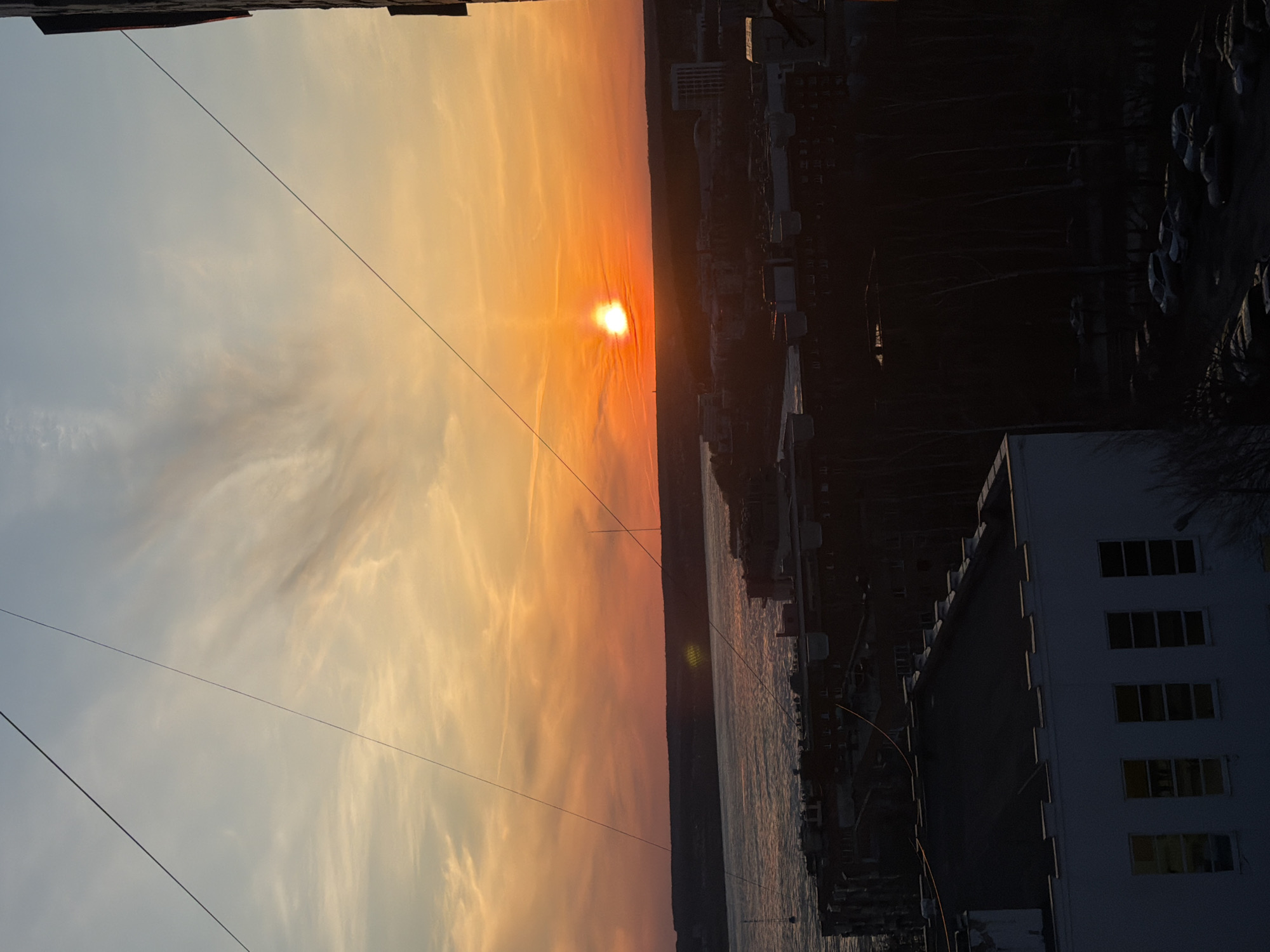 Afternoon scenes documented across Izhevsk including sunsets and cathedrals