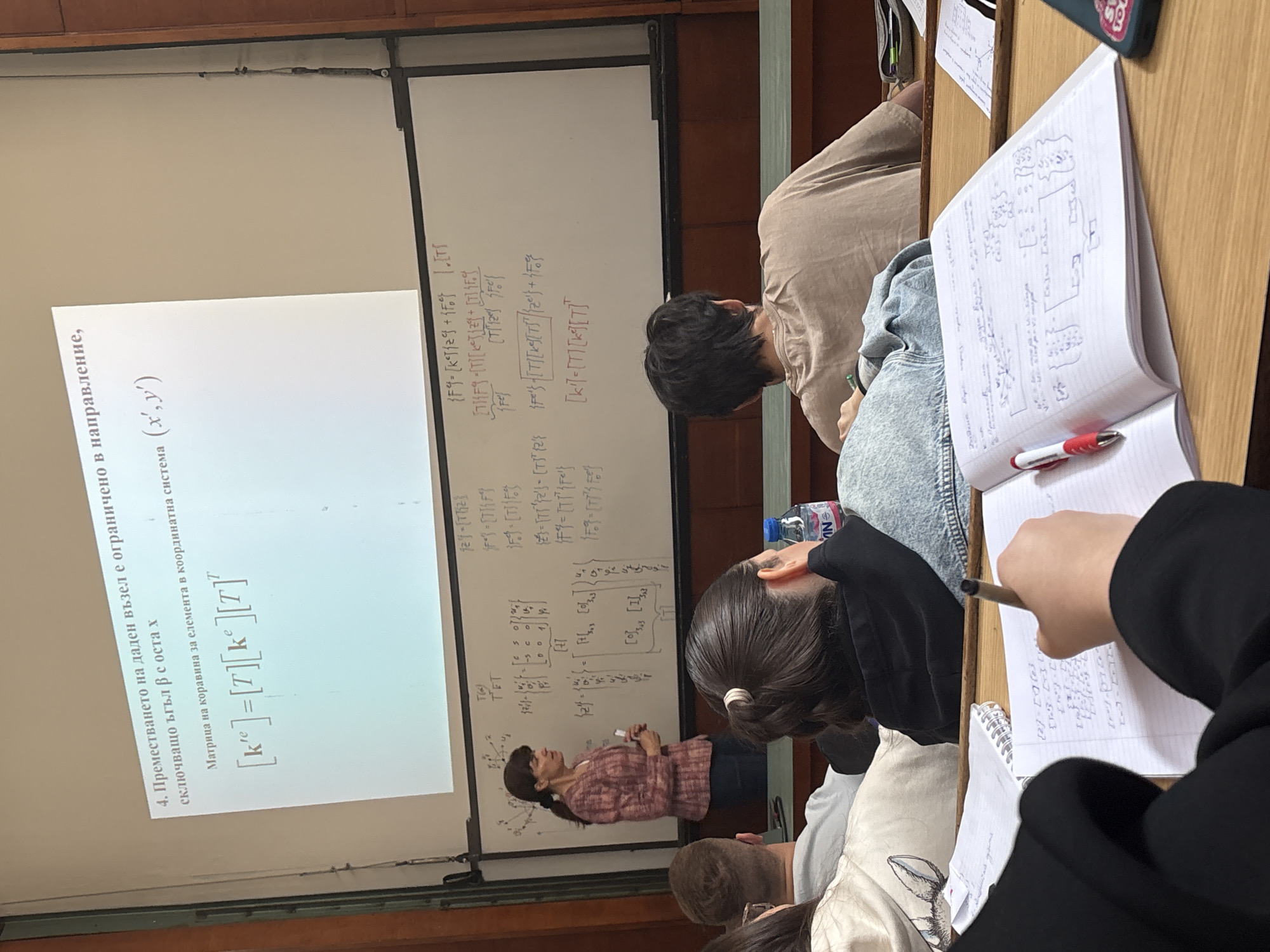 Professor delivers morning lecture with equations in Sofia classroom