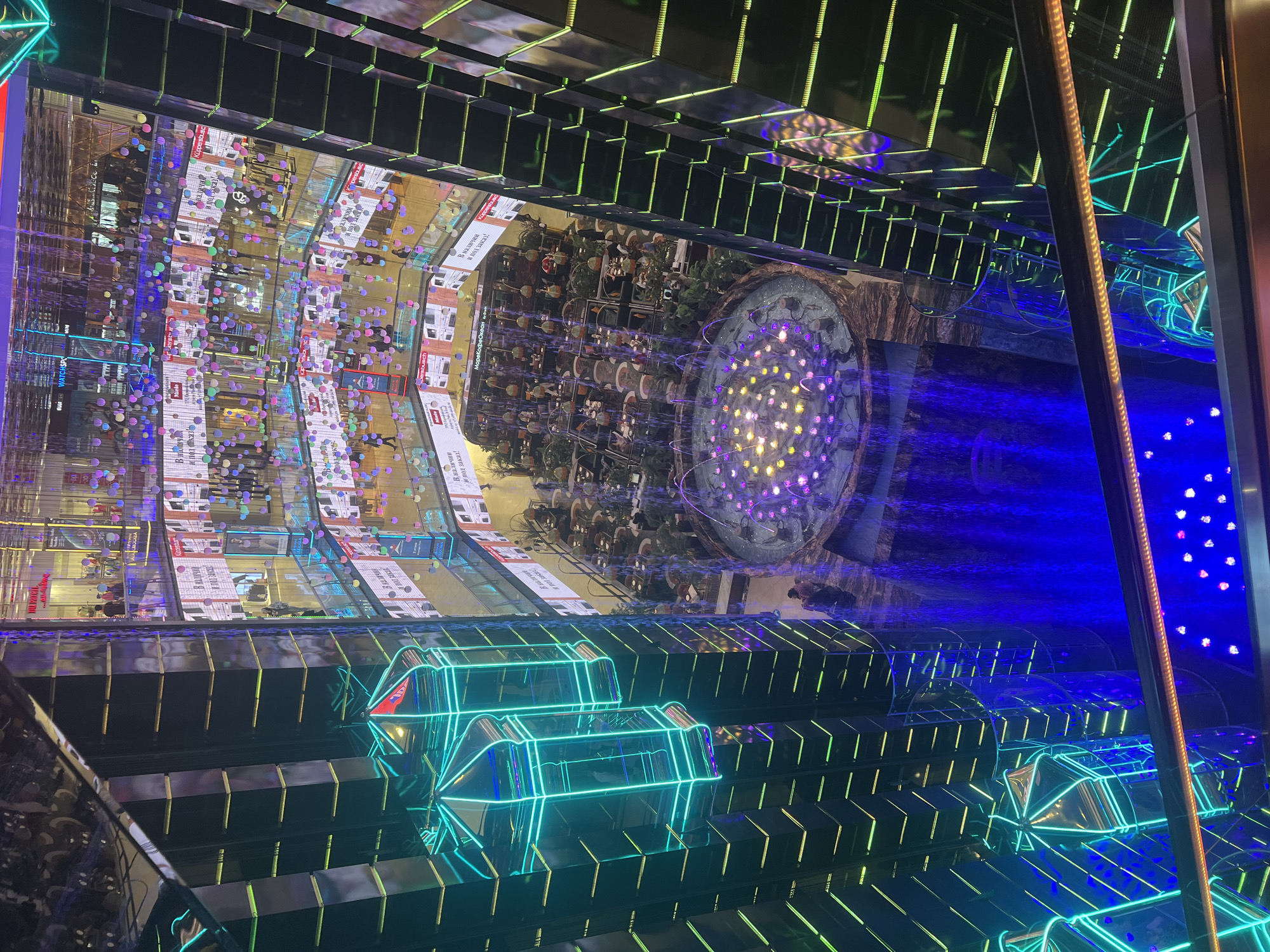 Moscow mall interior with roses, Ferris wheel documented