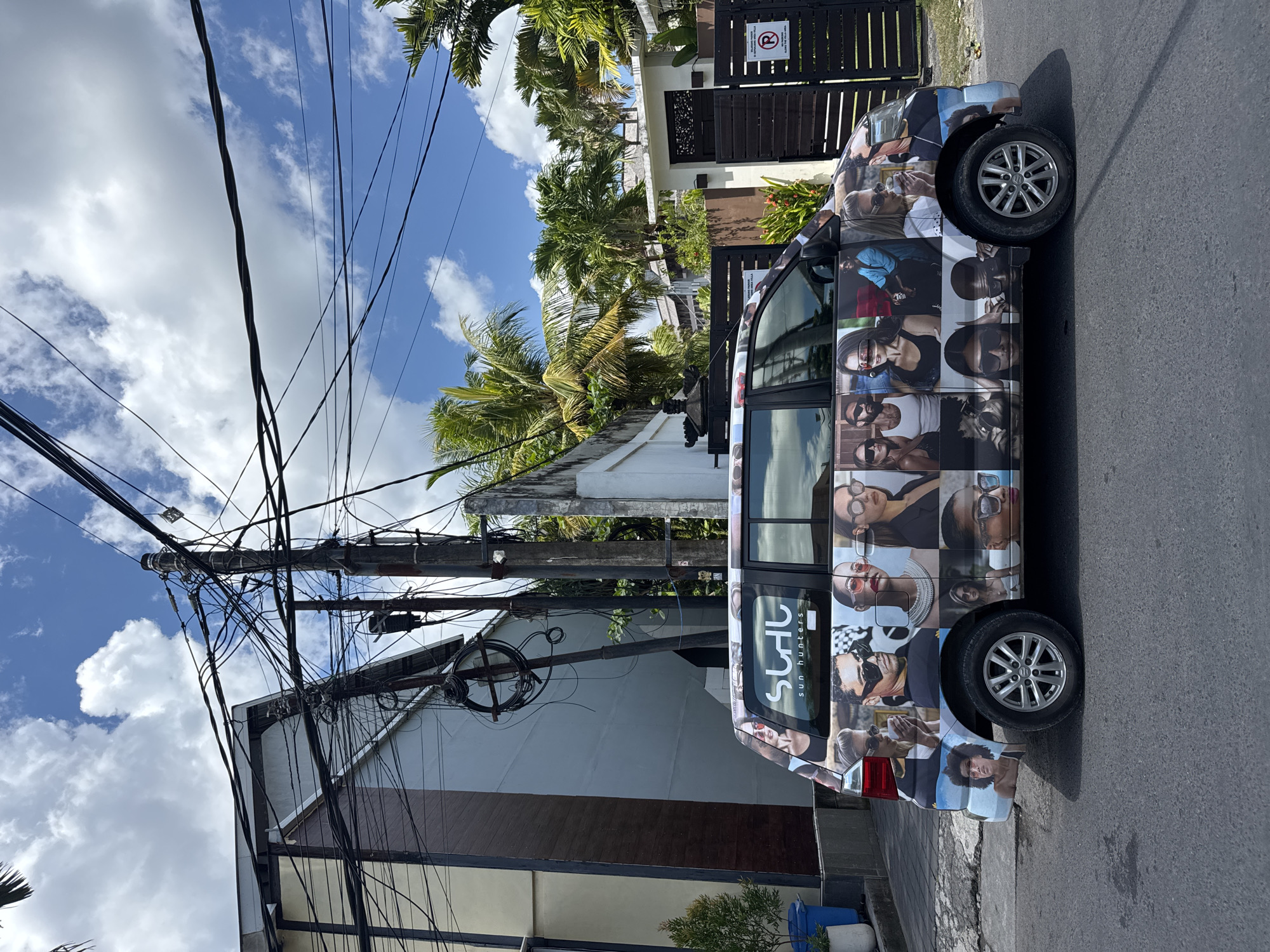 Advertising-wrapped minivan spotted on North Kuta street