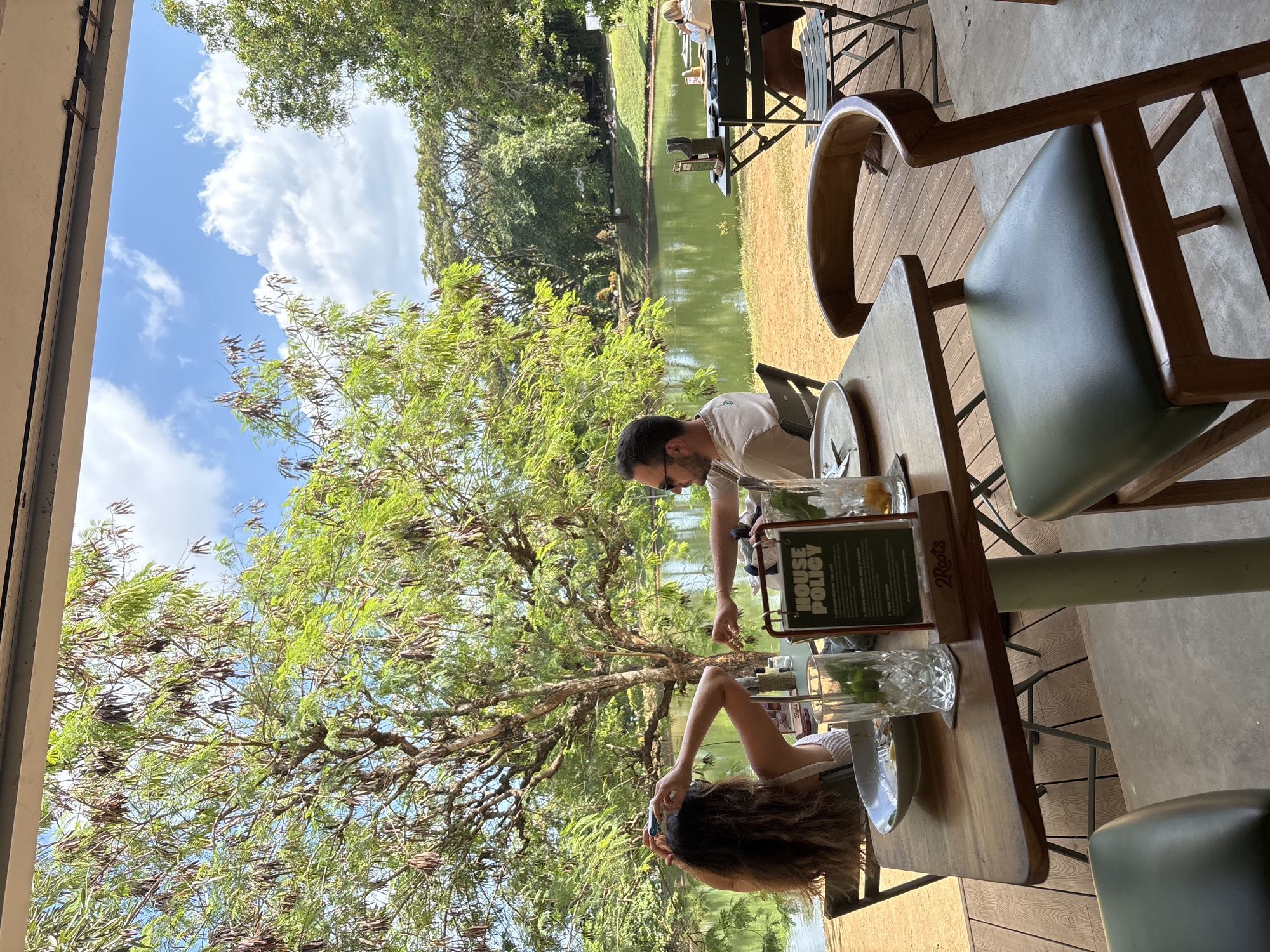 Outdoor dining captured at waterside resort in Kuta Selatan