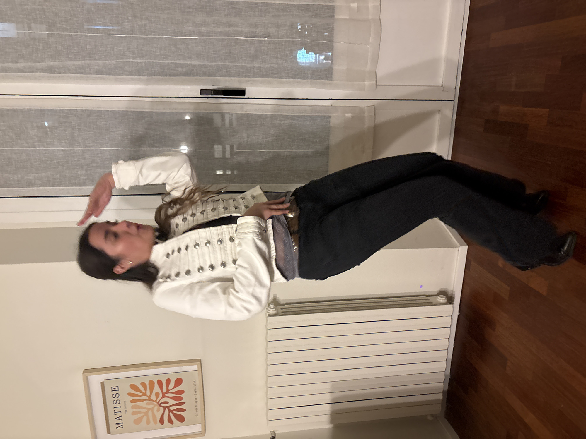 Person poses at window, tequila bottle spotted in Milan