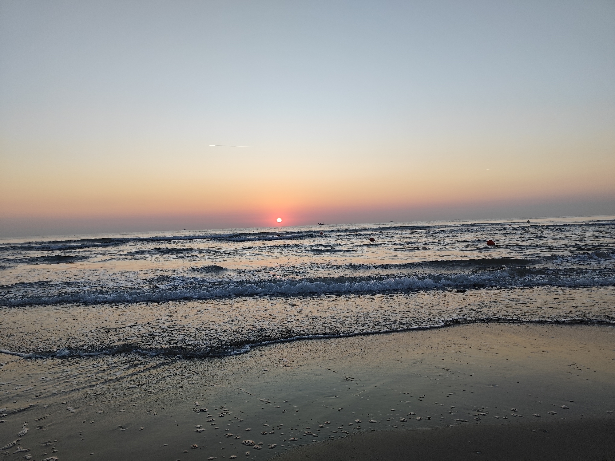 Sunrise breaking over the Adriatic at Rimini beach