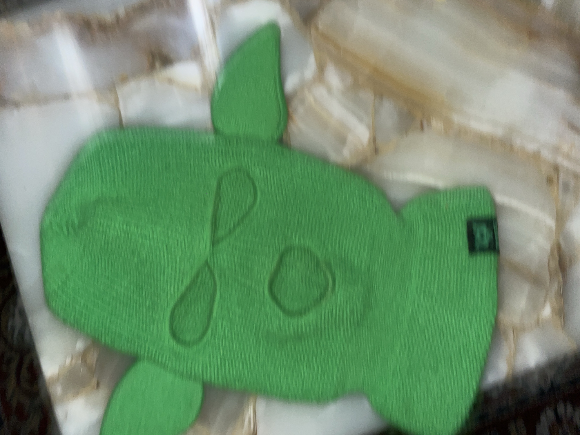 Person displays knitted turtle, snake necklace in La Lucila