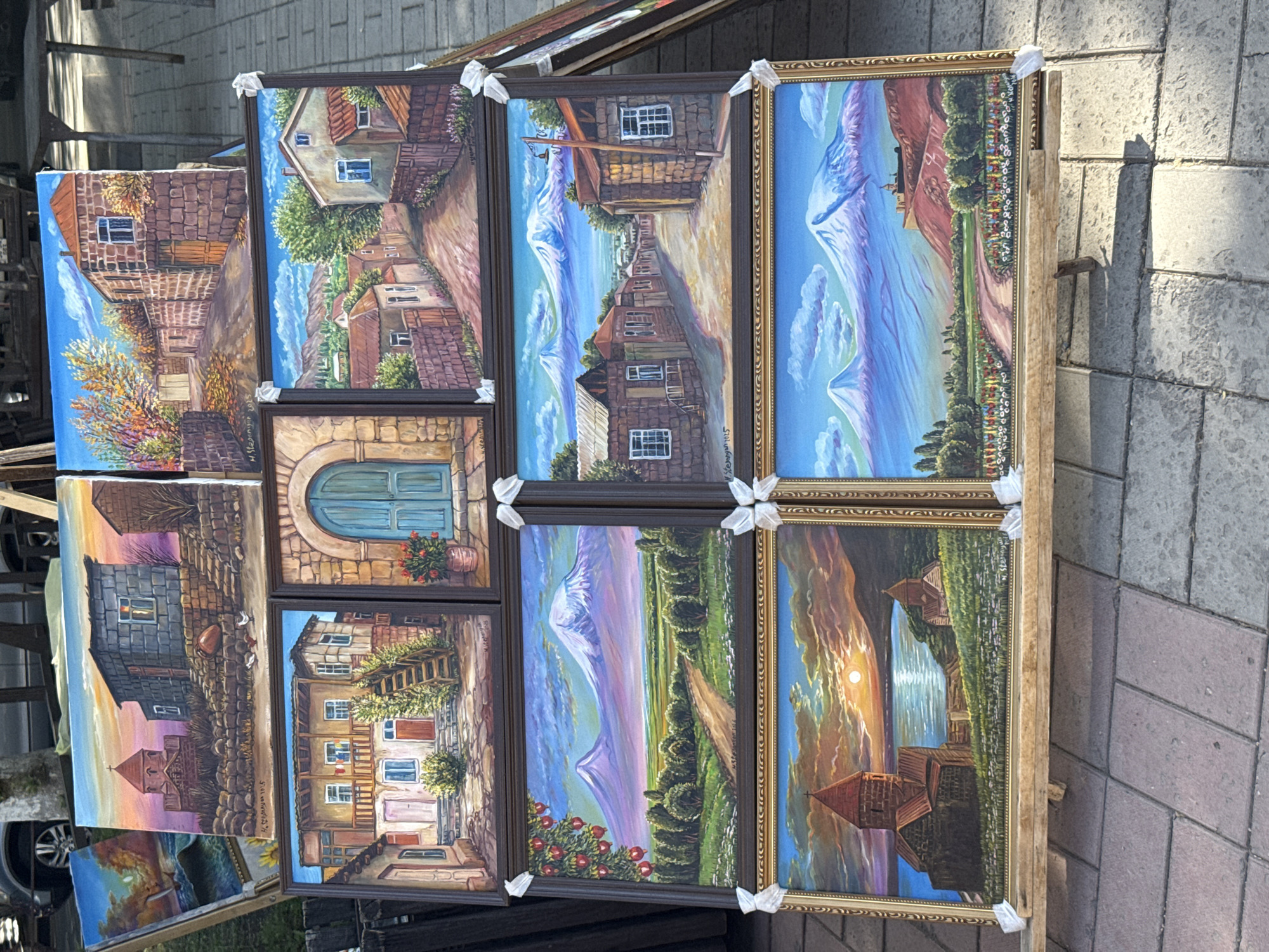 Street art vendor displays landscape paintings in Yerevan