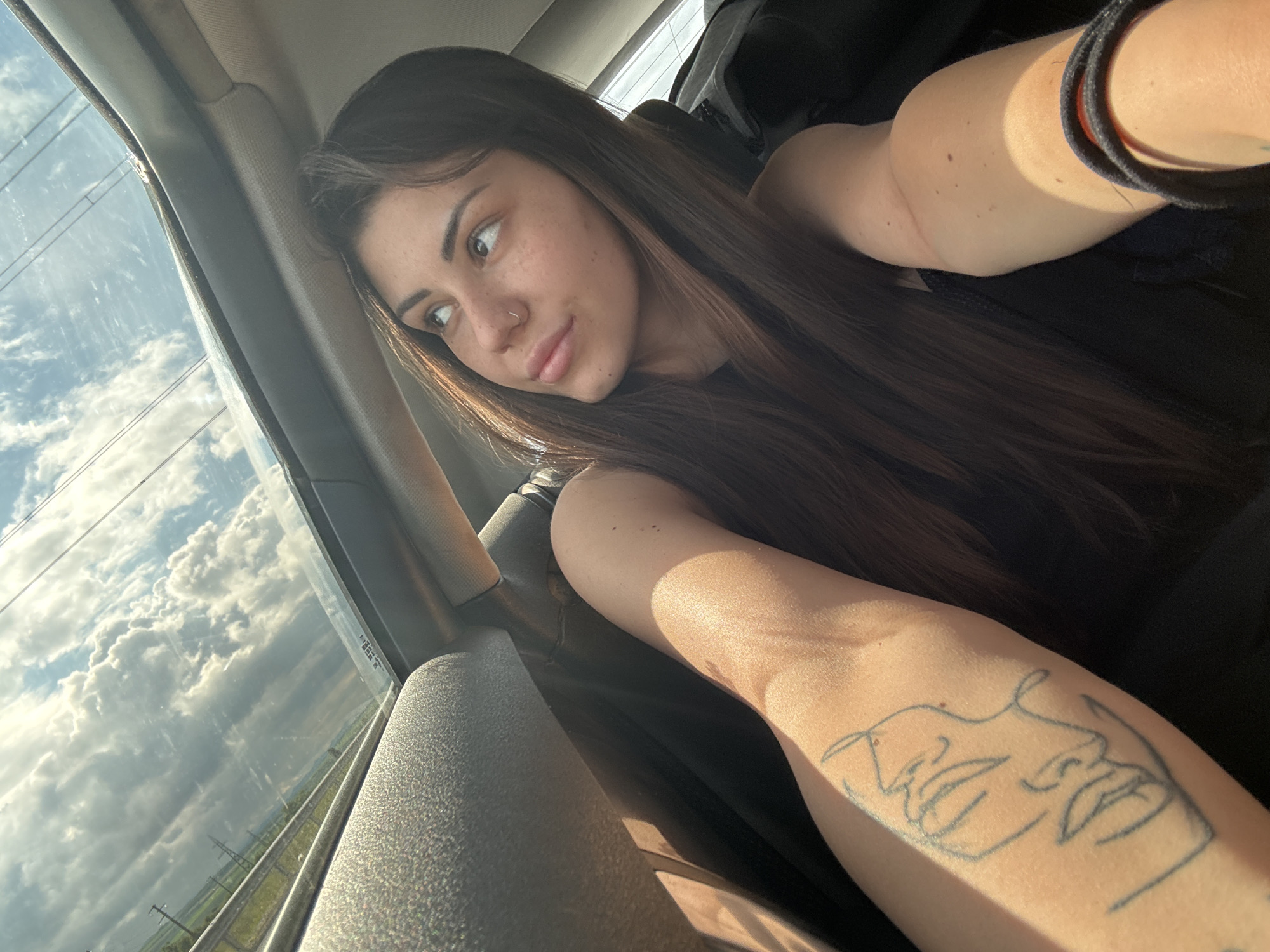 Woman documents car journey through Bulgarian countryside with selfies