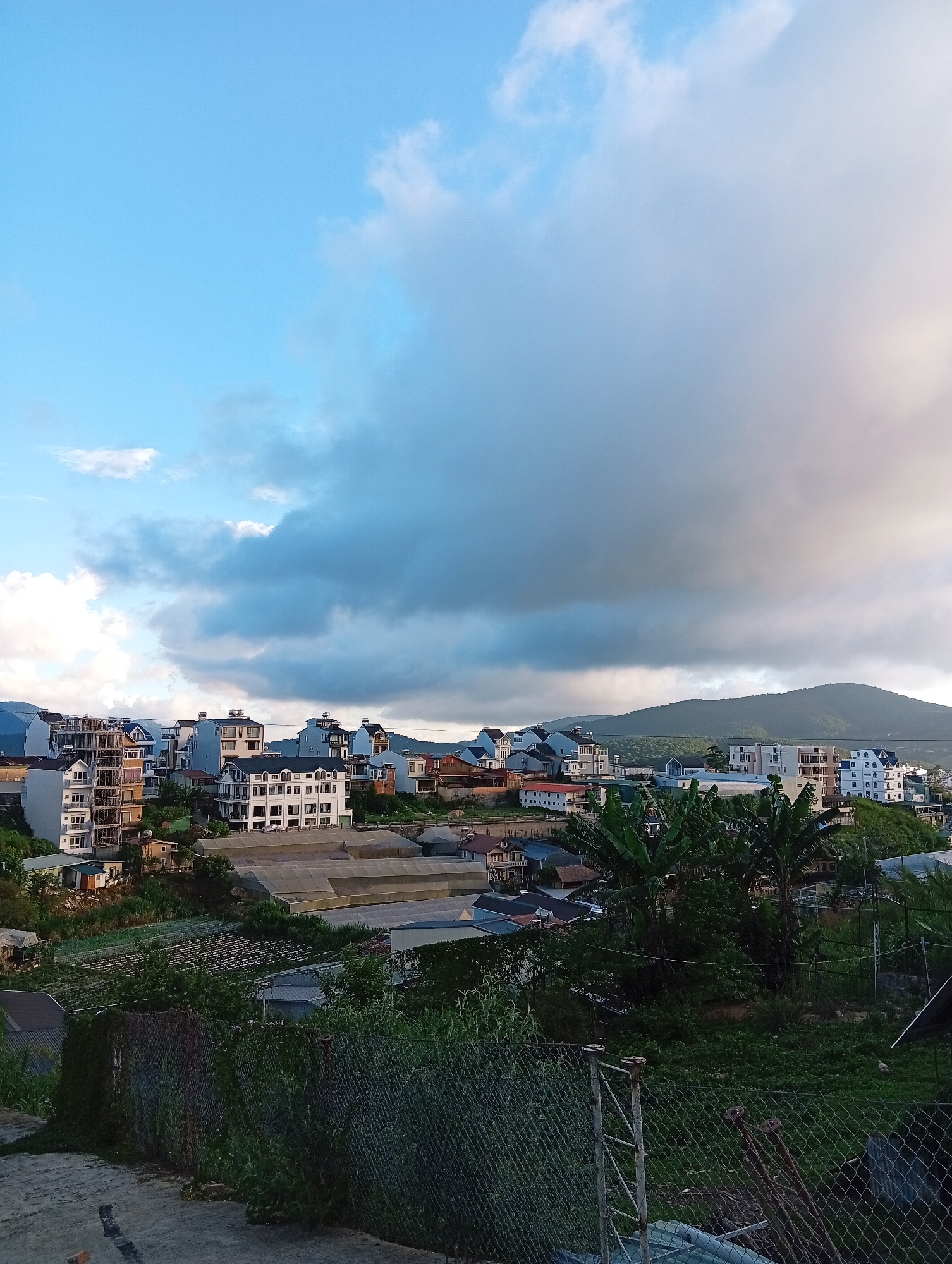 Dramatic sky captured over Da Lat cityscape from elevated viewpoint