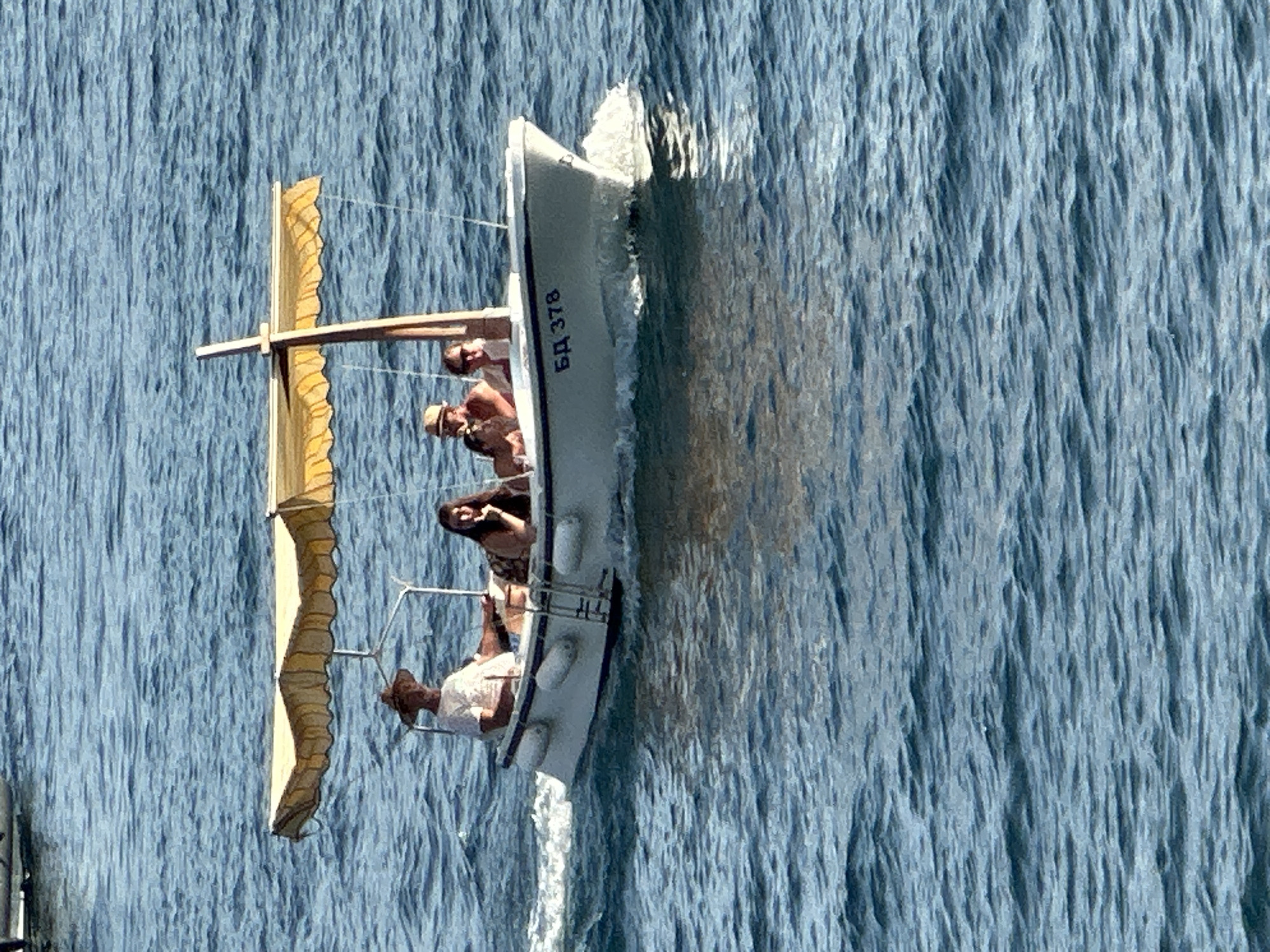 Boats and clear water off the Budva coast on a summer afternoon