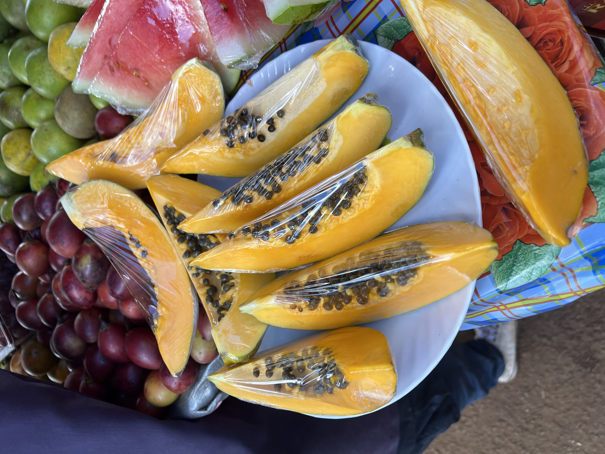 Street vendors sell fresh produce in Nyeri marketplace