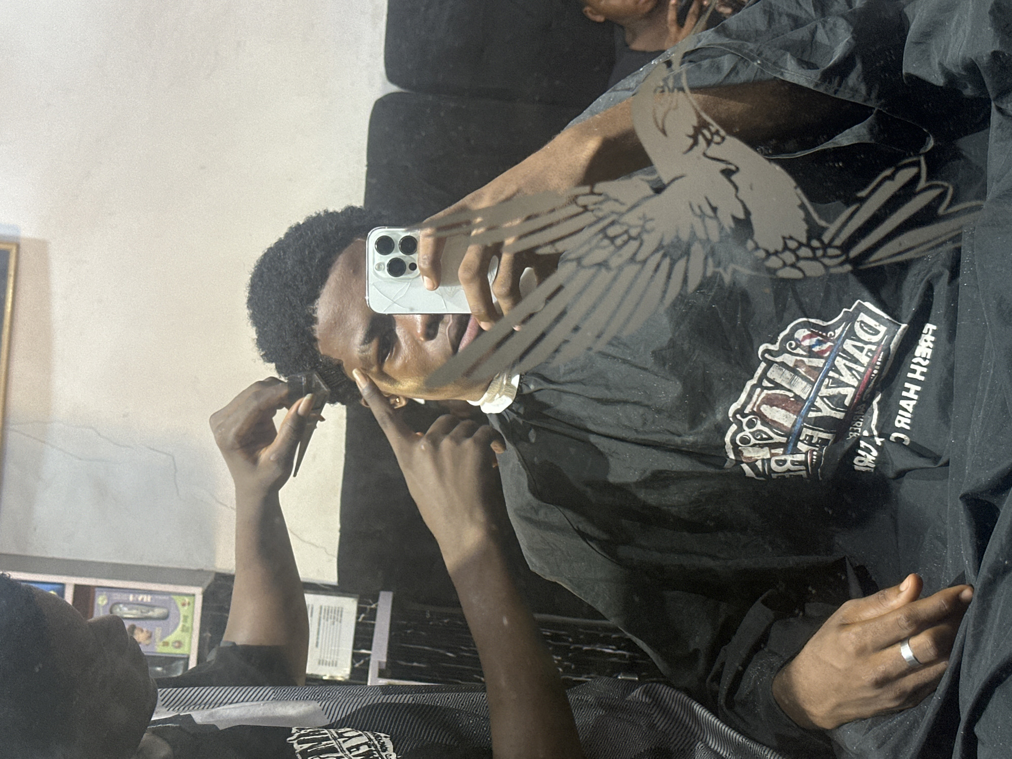 Routine barbershop visit documented in Ogwashi-Uku, Nigeria