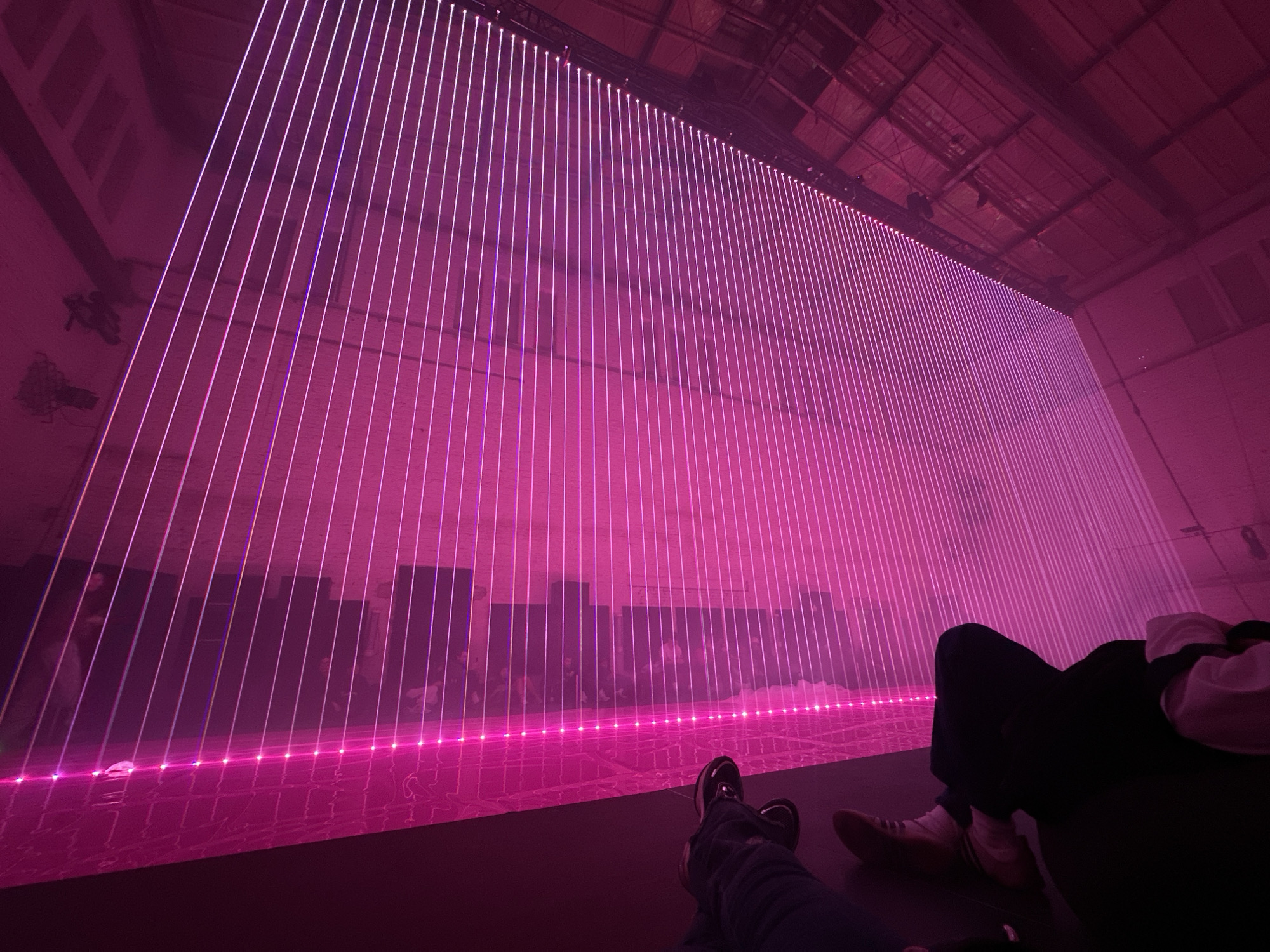 Pink laser art installation draws visitors in Berlin