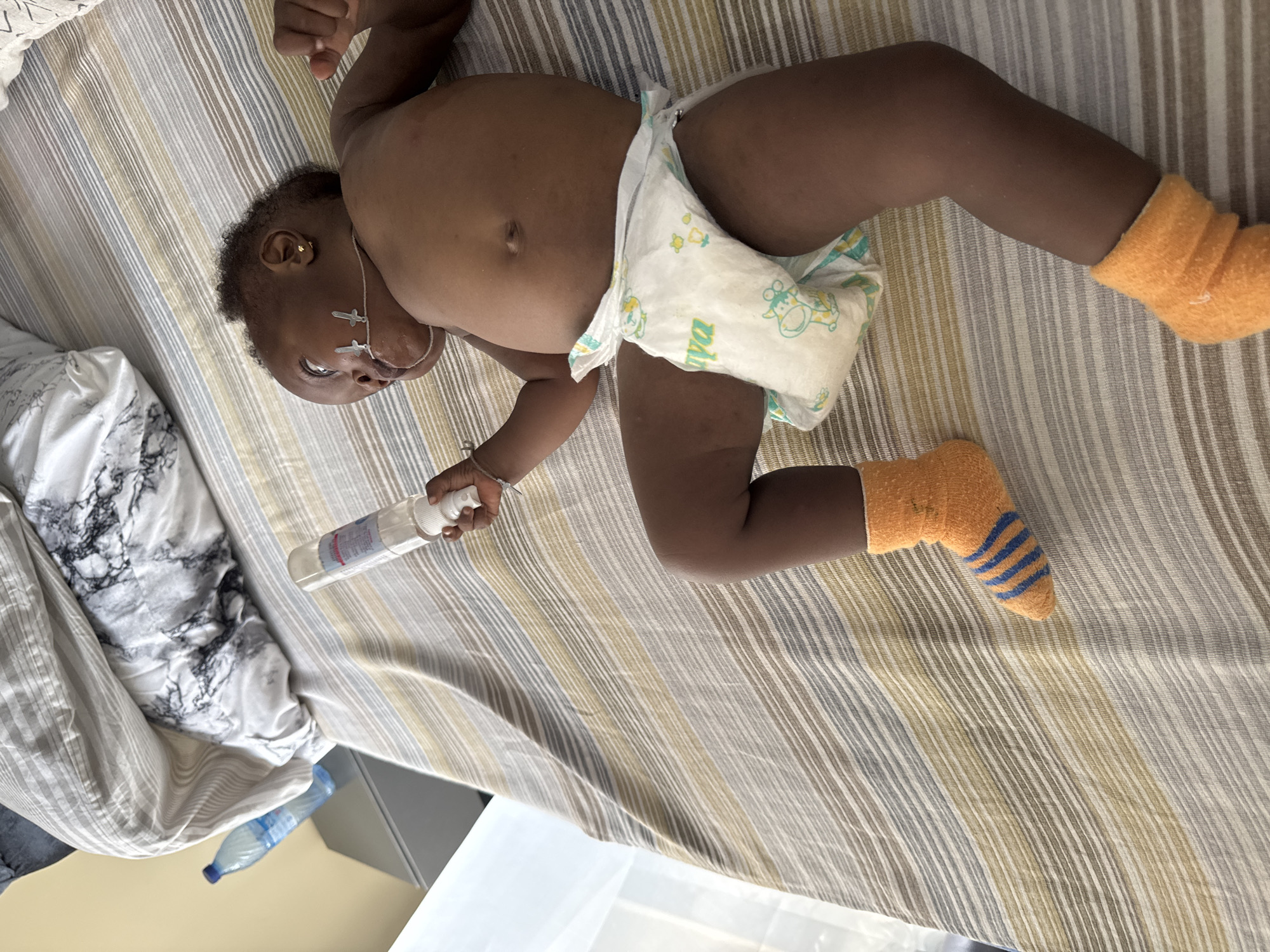 Baby with medical care observed at home in Nigeria