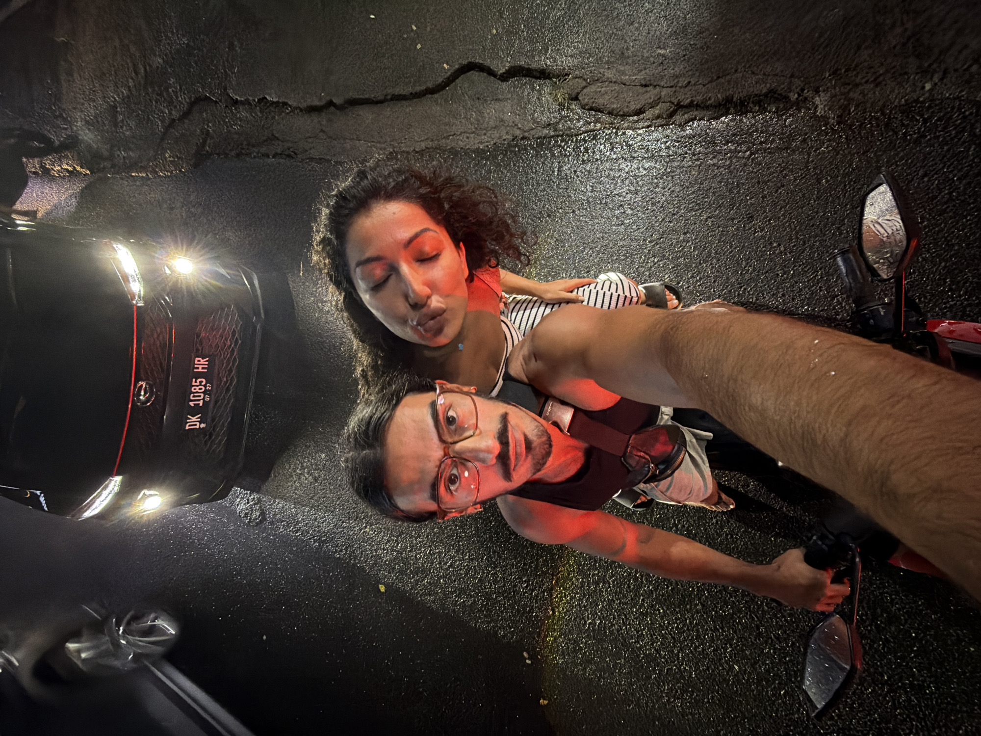 Couple takes nighttime selfies on Mengwi street