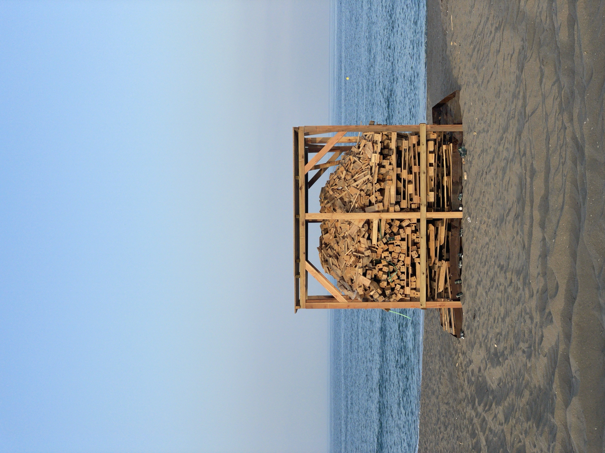 La Línea beachfront at dusk: sand, cafés, and construction