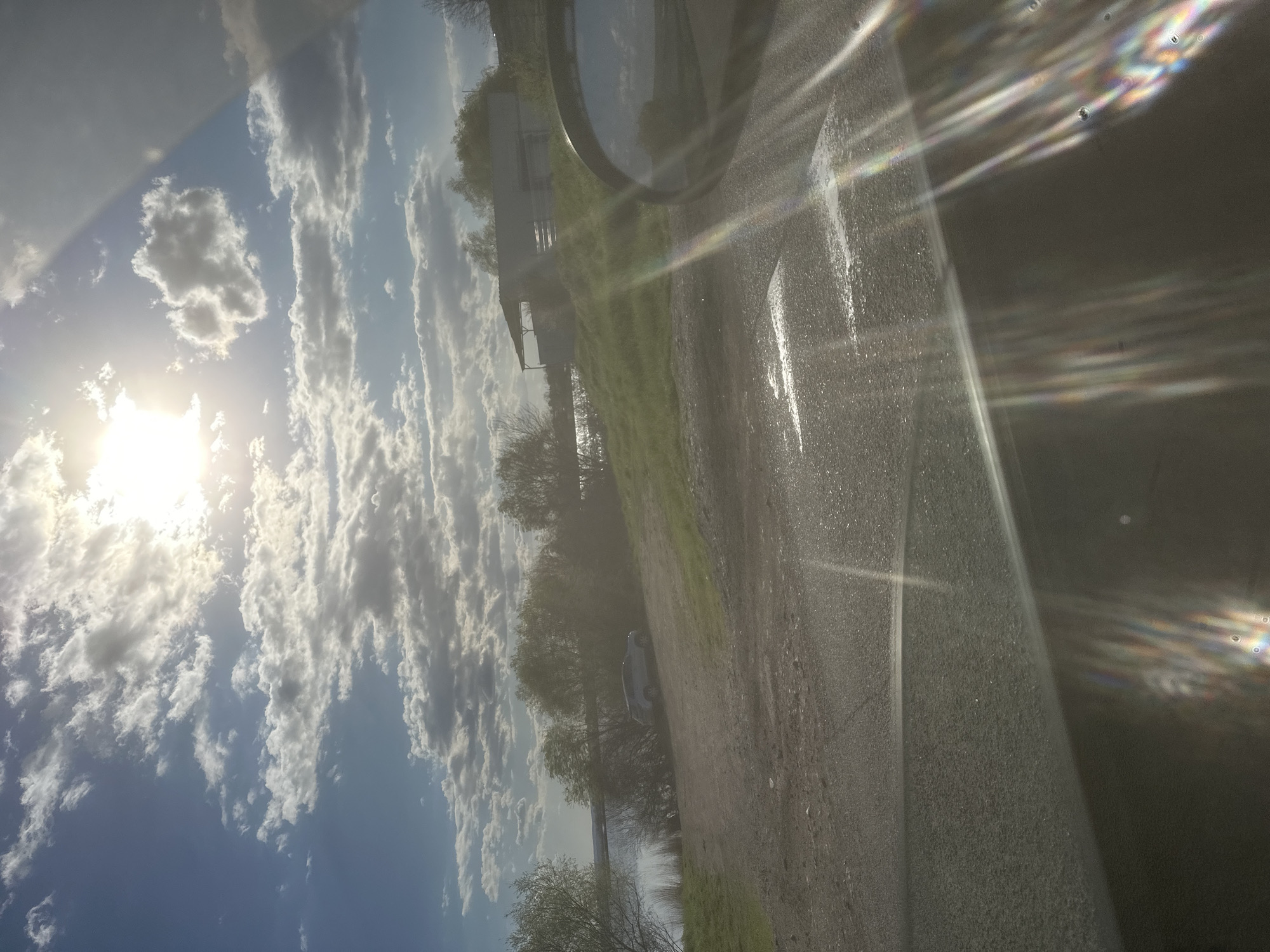 Sunny skies observed through vehicle windshield in Burgas