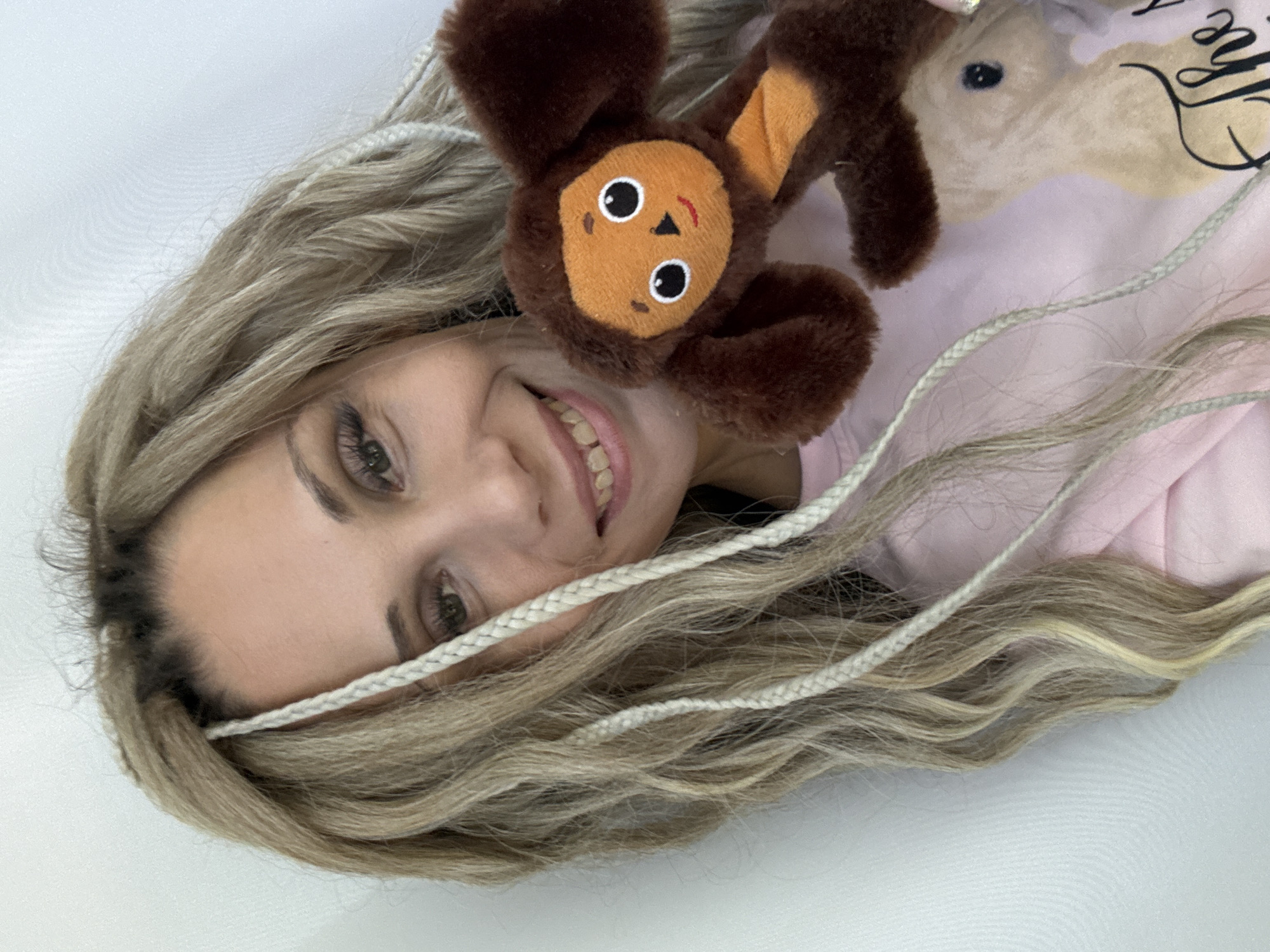 Woman poses with stuffed animal in Zavolzhye morning photo