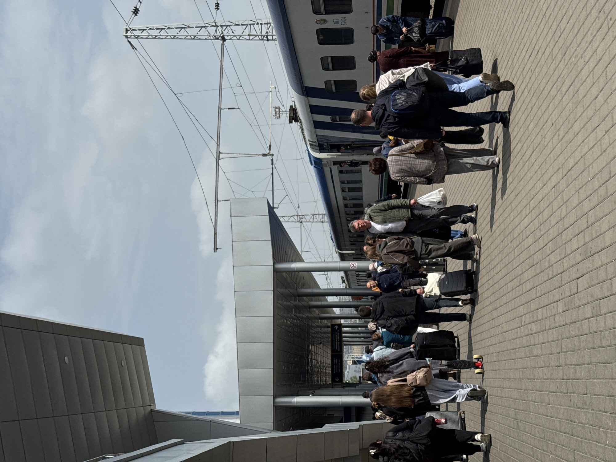 Morning commuters queue at Tashkent station for train departure