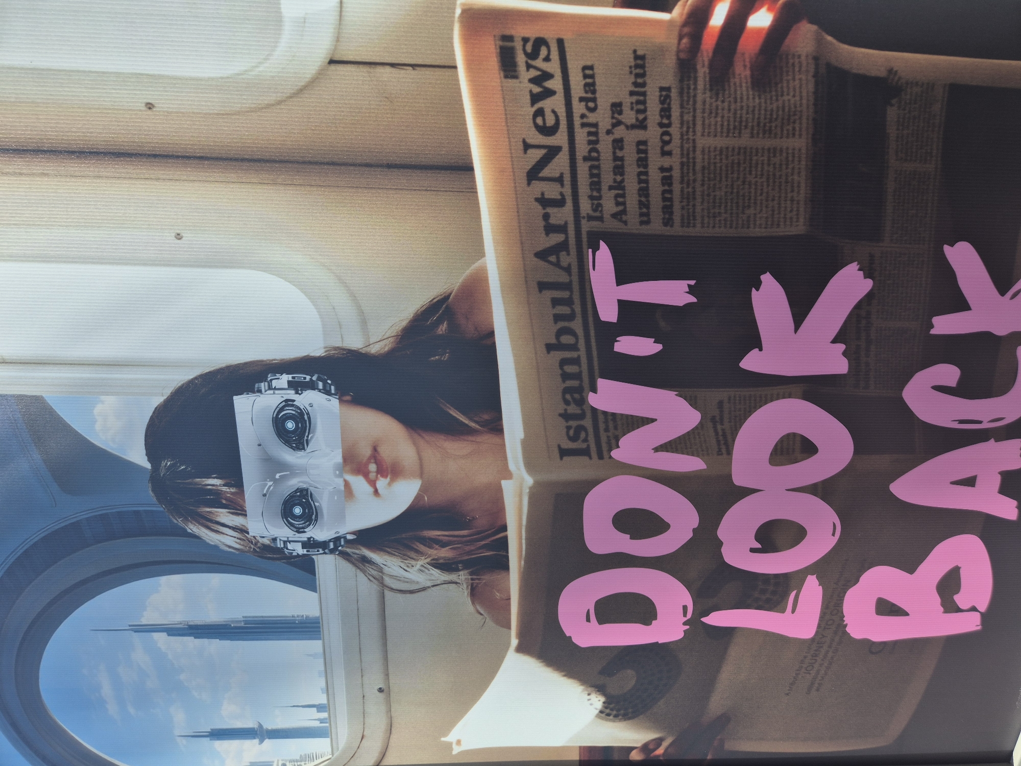 Woman with robotic face reads Turkish arts newspaper in Genoa