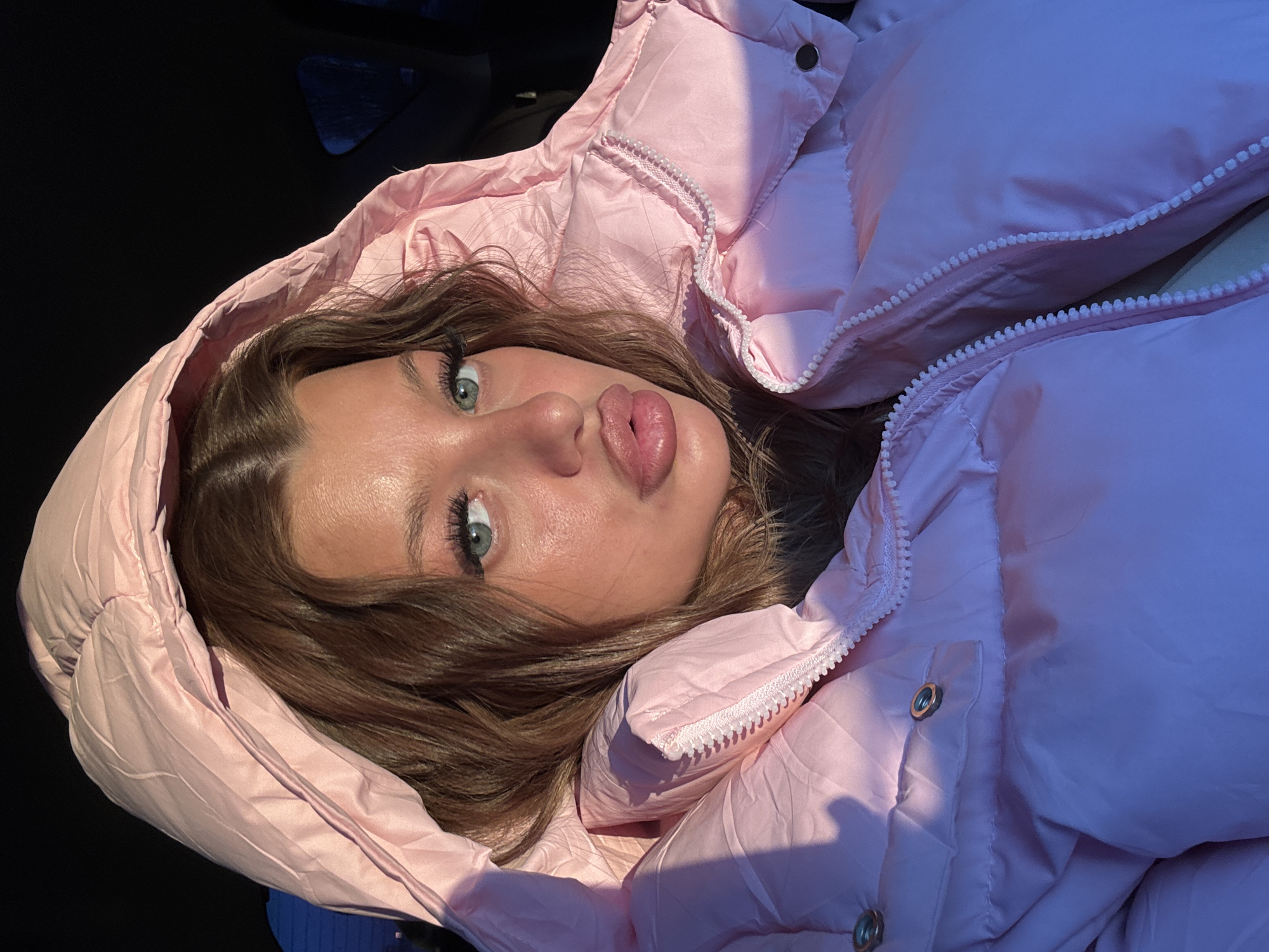 Woman takes selfie in pink jacket in Omsk