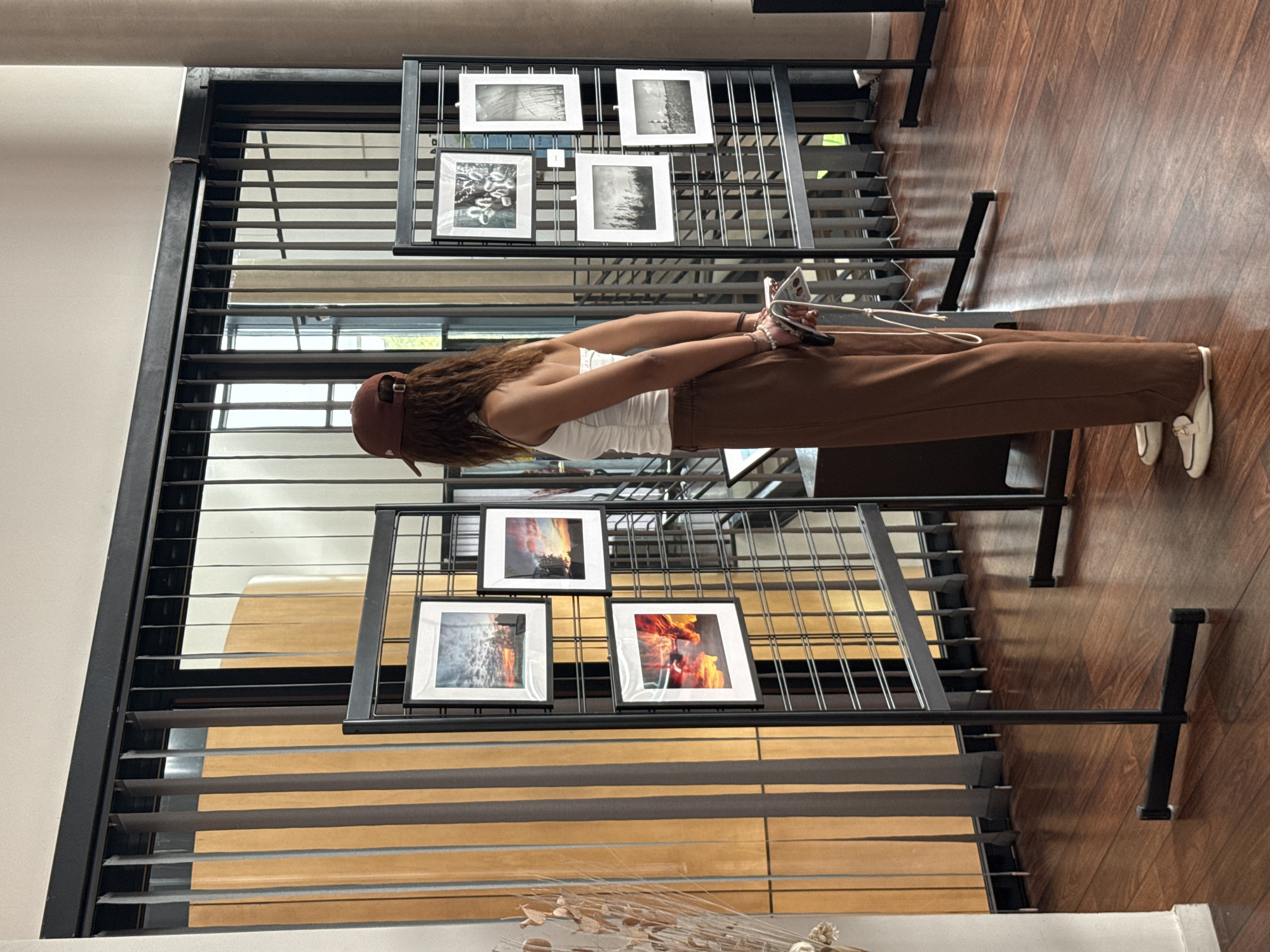 Woman visits photo display and antique typewriter in Domont
