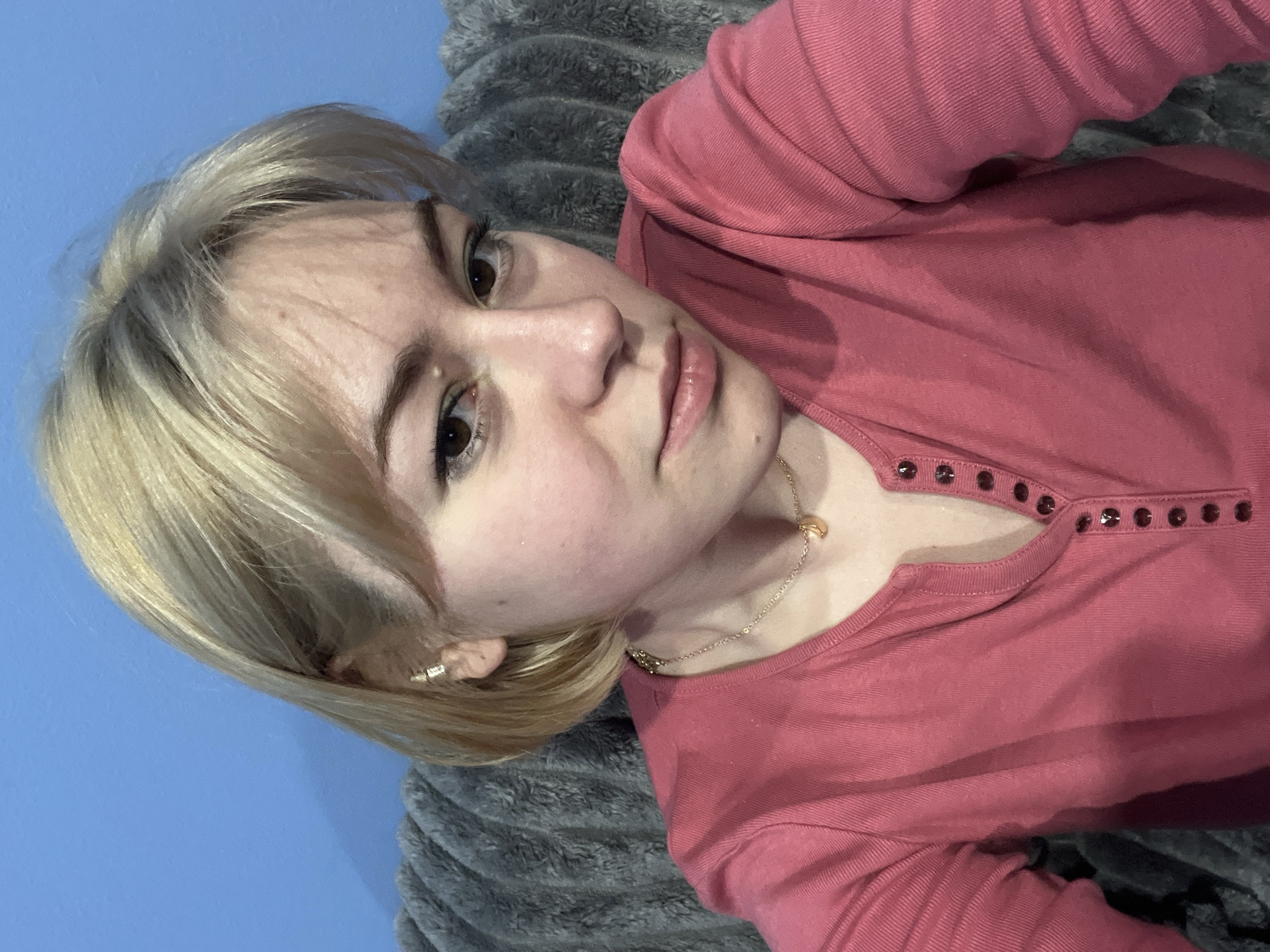 Young woman takes indoor selfie in Odesa, Ukraine