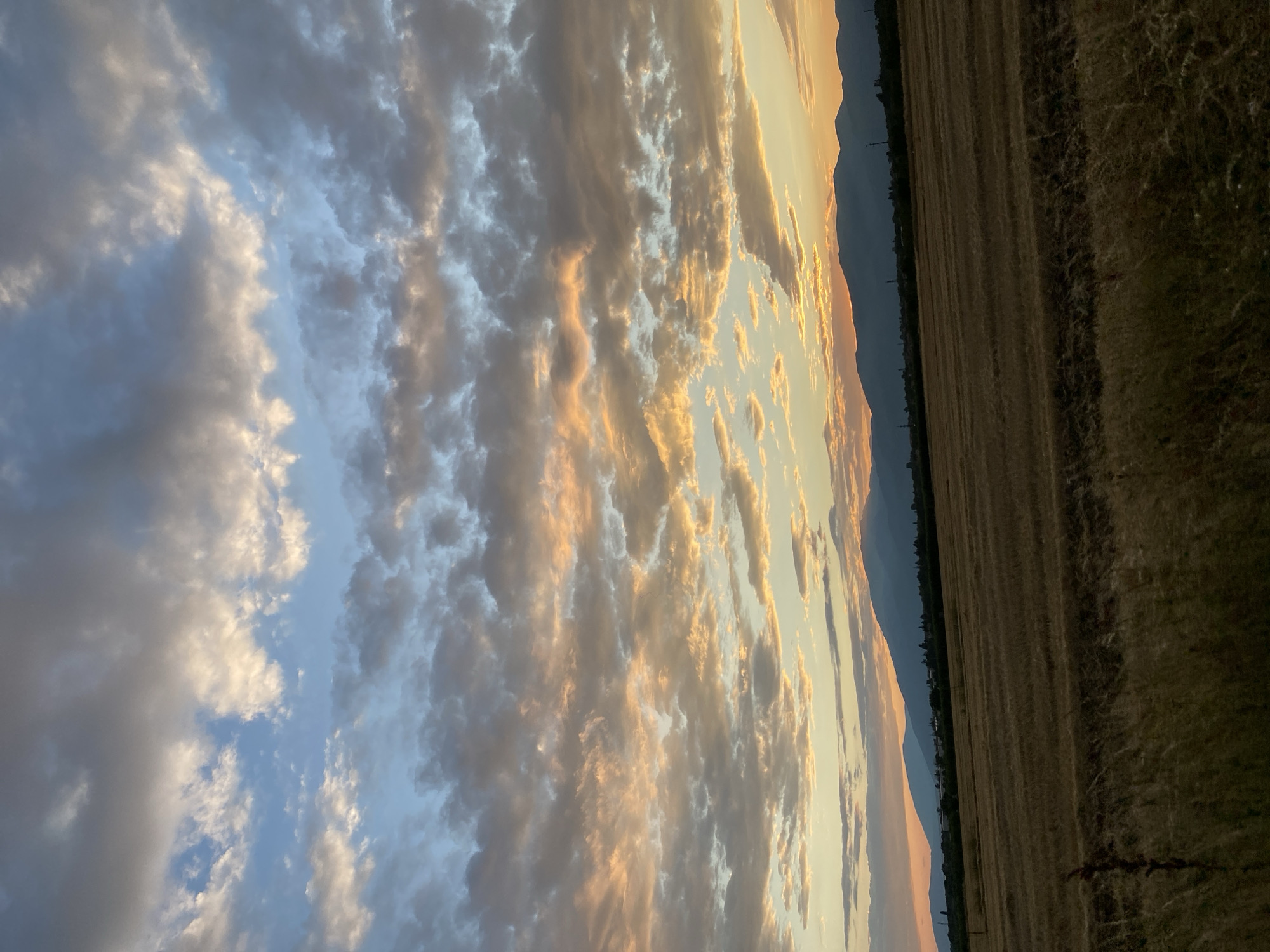 Golden hour clouds roll over the Bulgarian sky near Enina