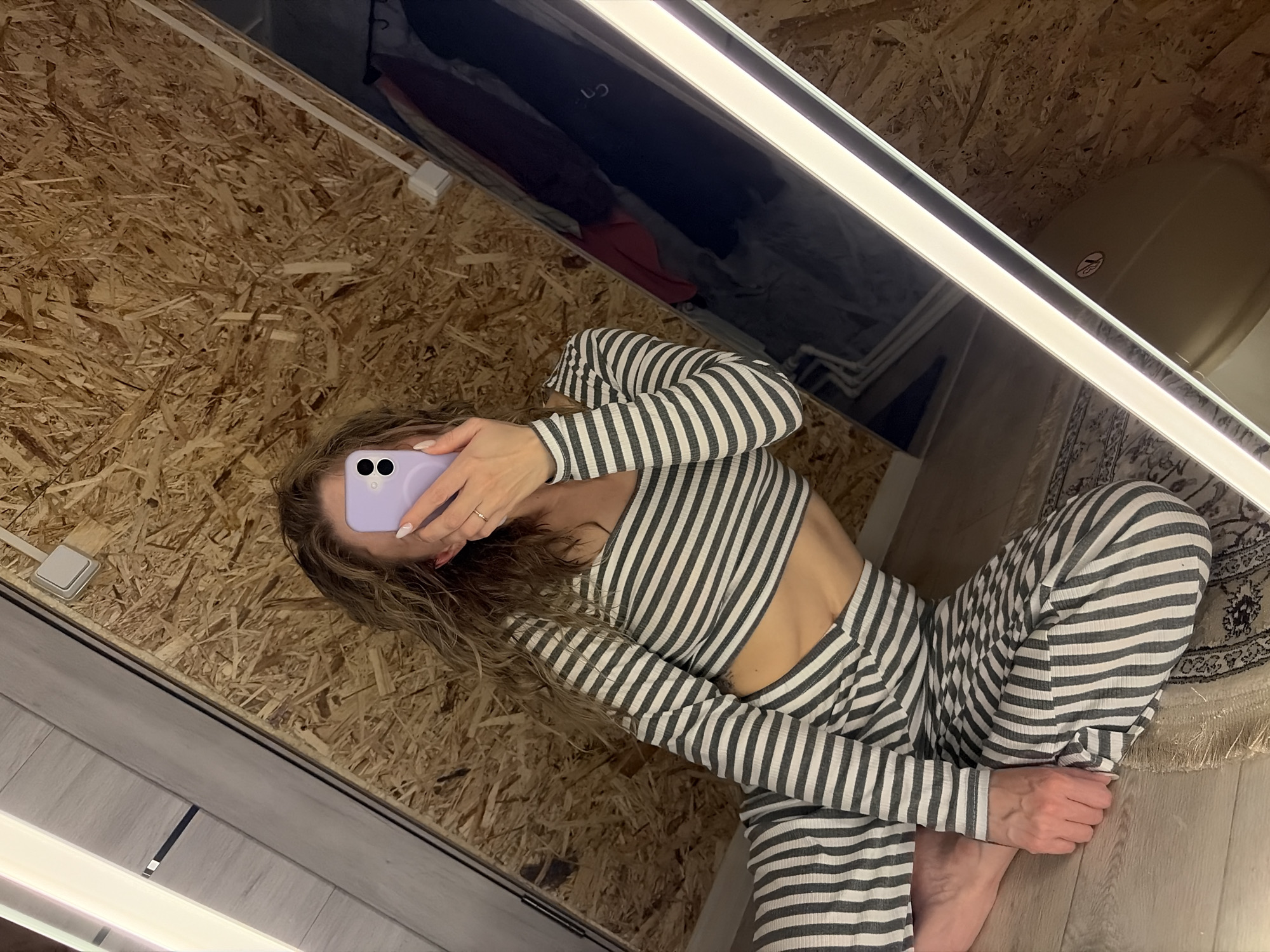 Mirror selfie session documented in Chaikovsky residential interior
