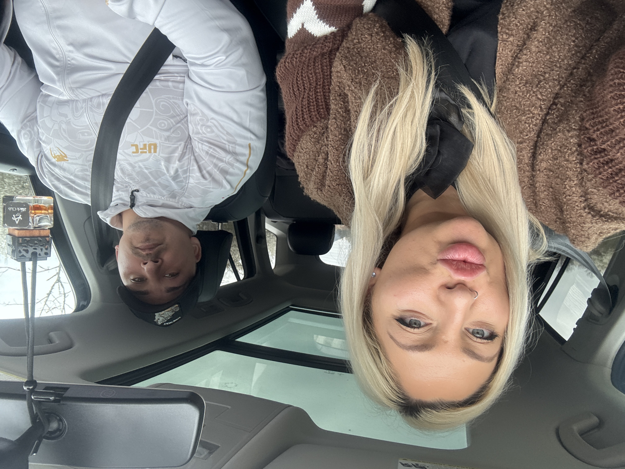 Couple in car making peace sign in Zaia Bulgaria