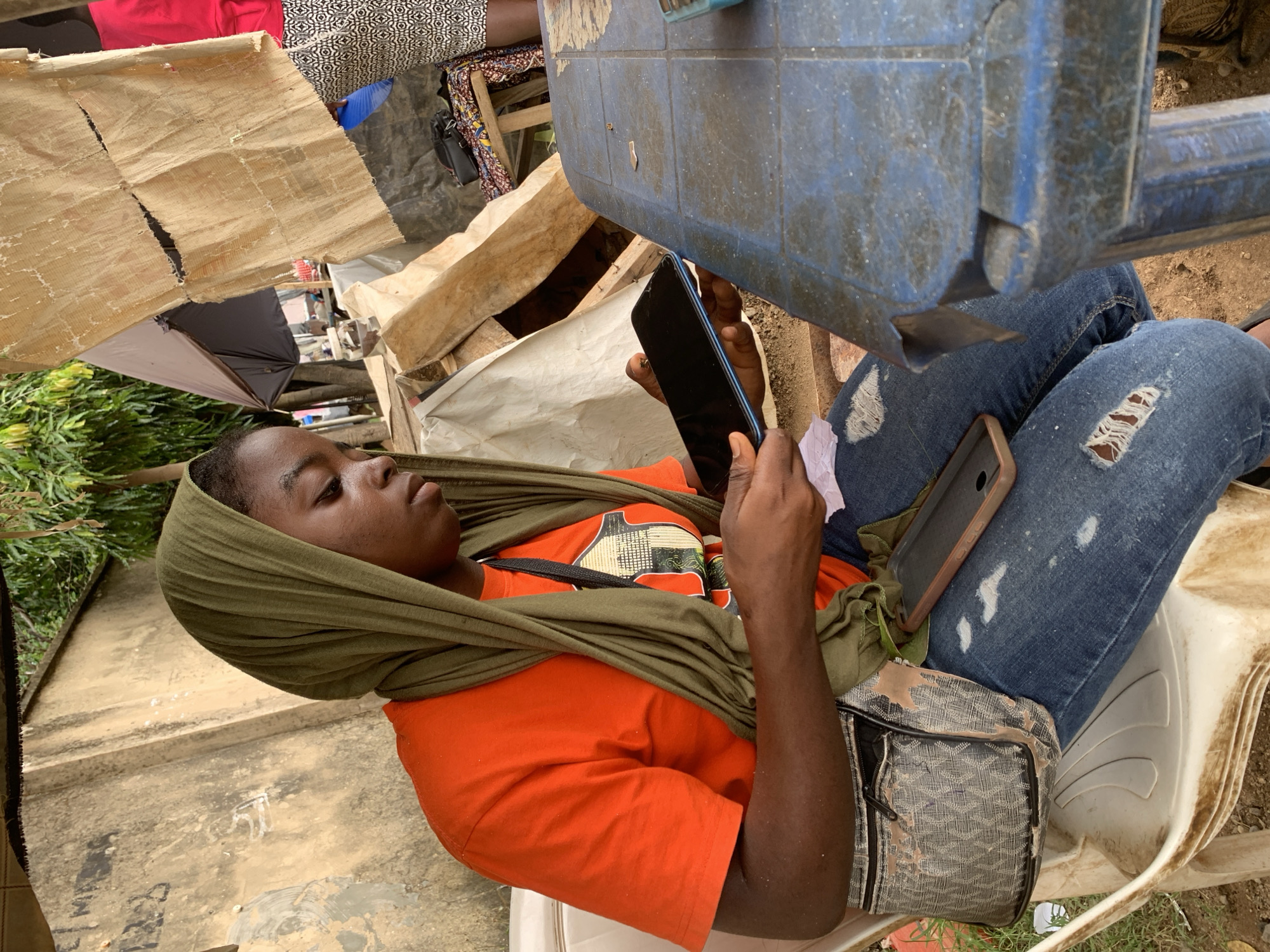 Busy Abuja roadside corner: vendors, commuters, and street life