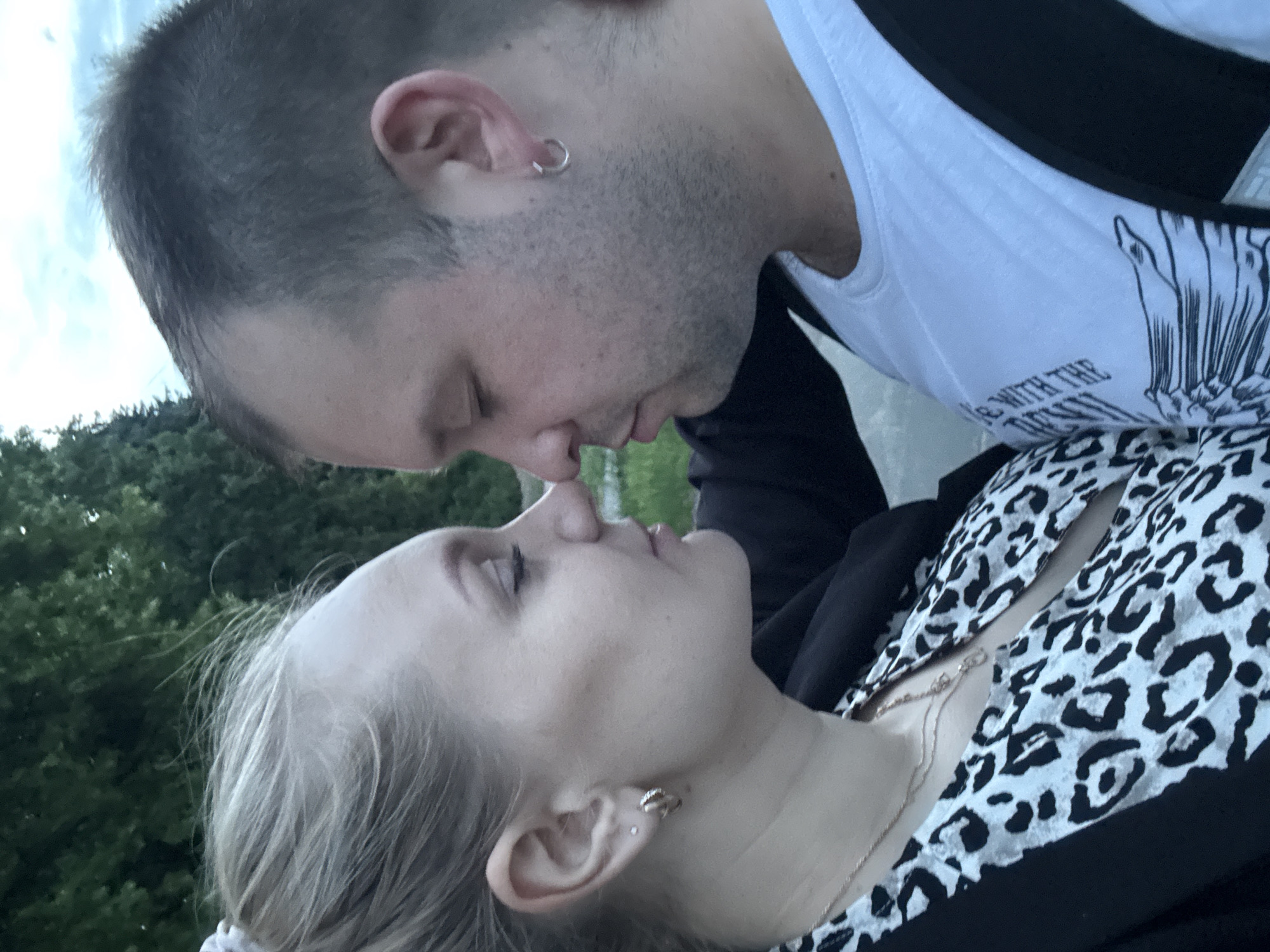 Couple's evening stroll through Poznan gardens and military memorial documented