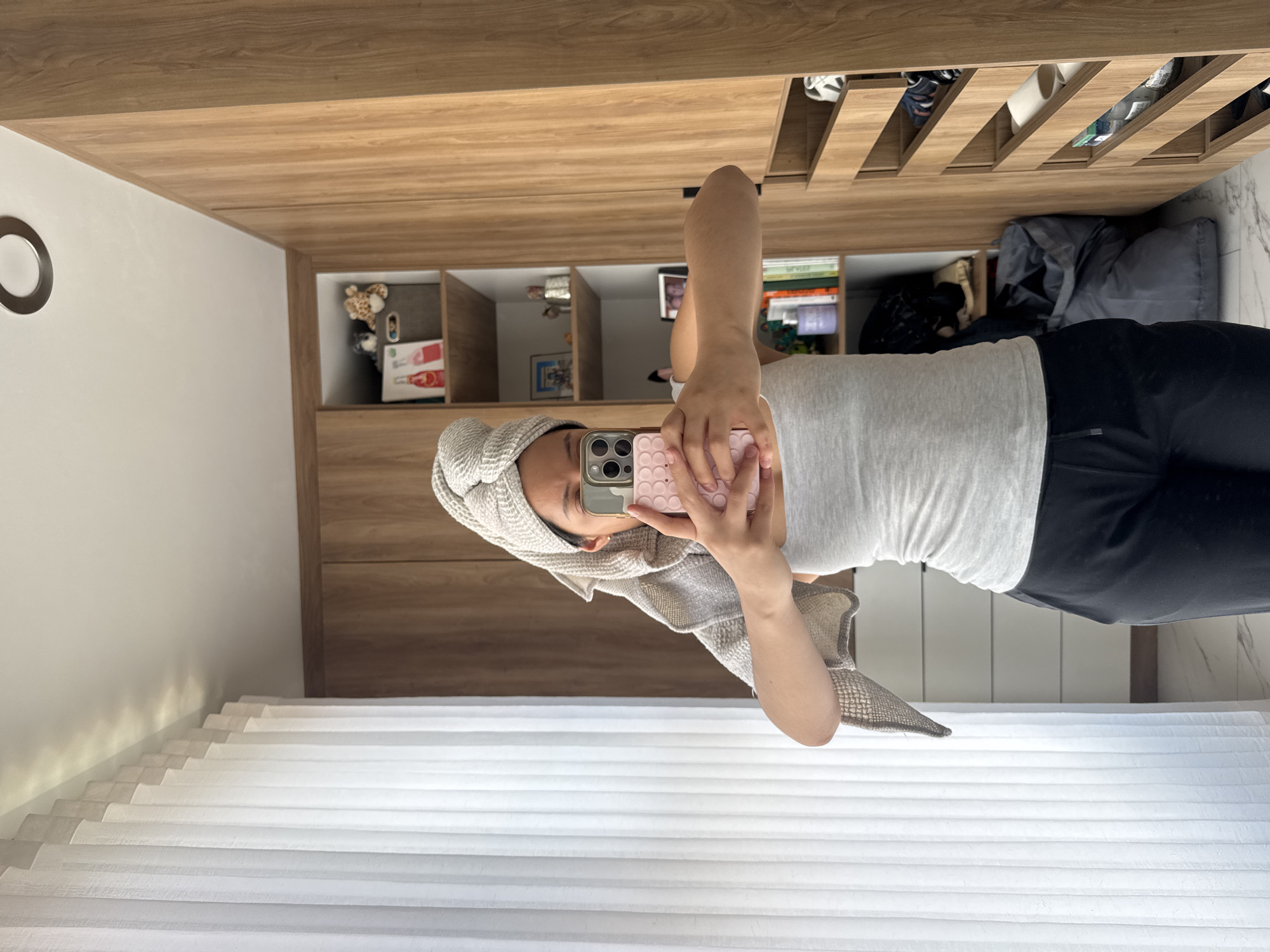 Person takes mirror selfie with towel in Puebla