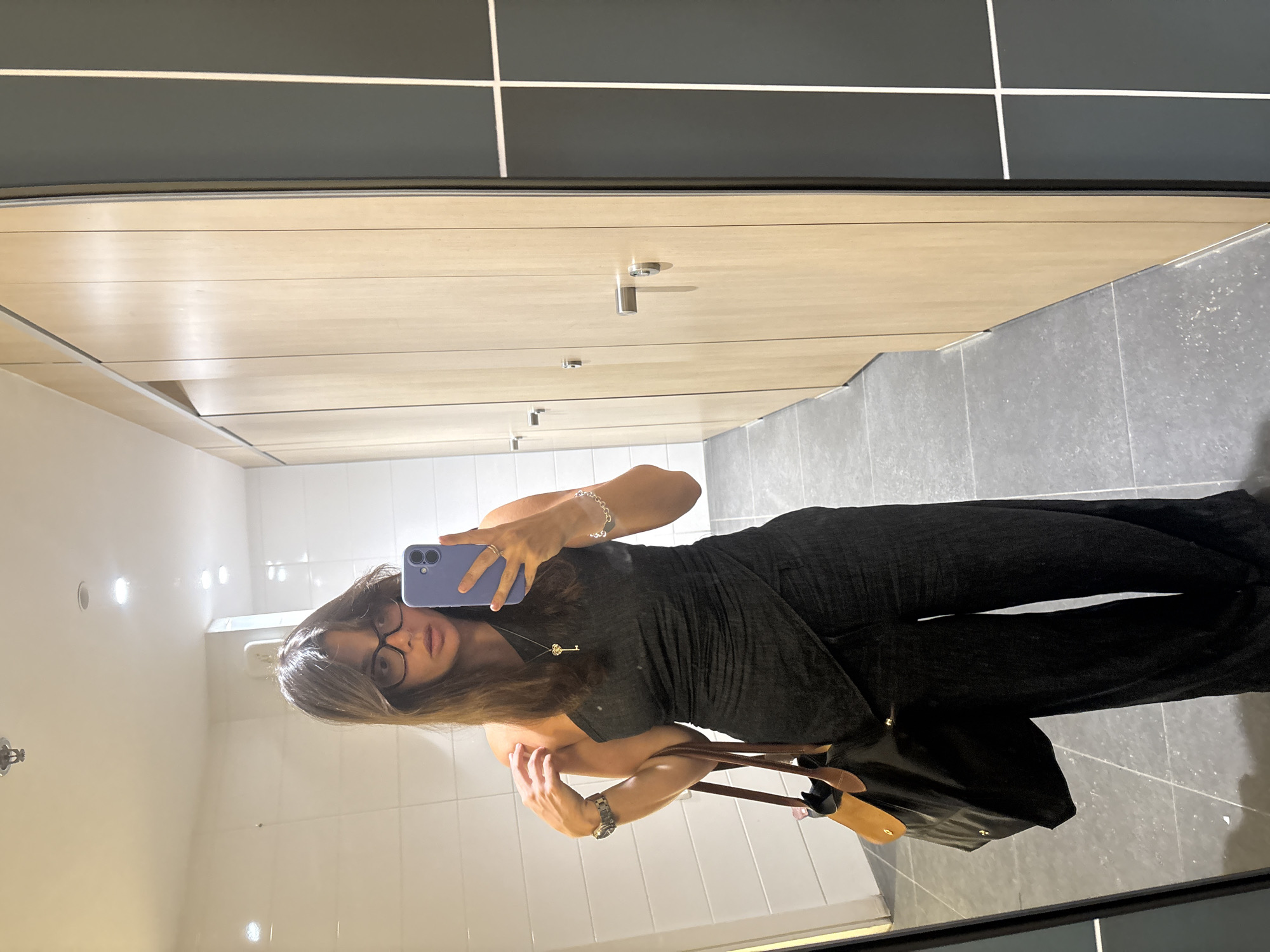 Woman Takes Mirror Selfie in Tel Aviv Public Facility
