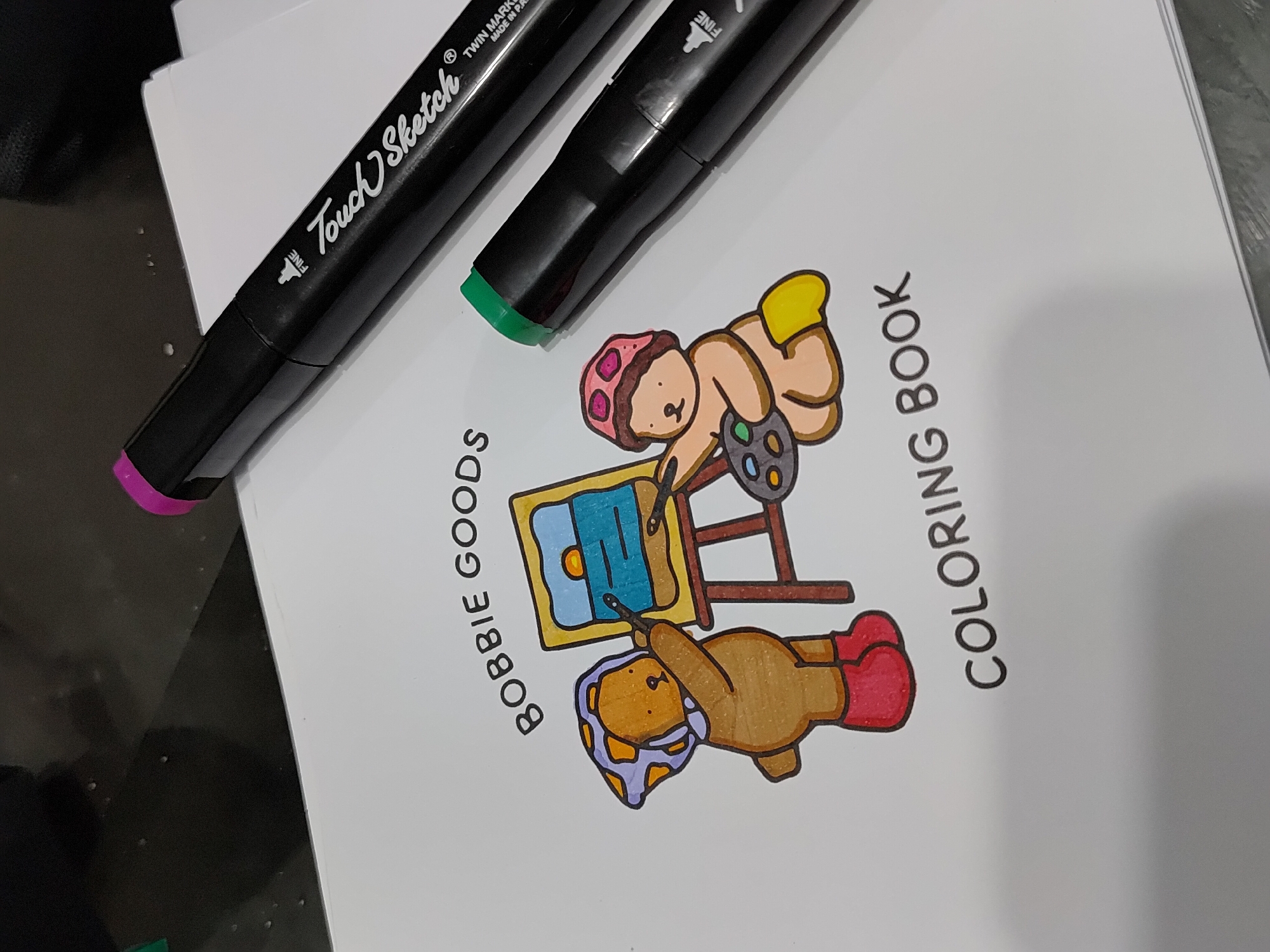 Art supplies and coloring book captured in Curitiba home
