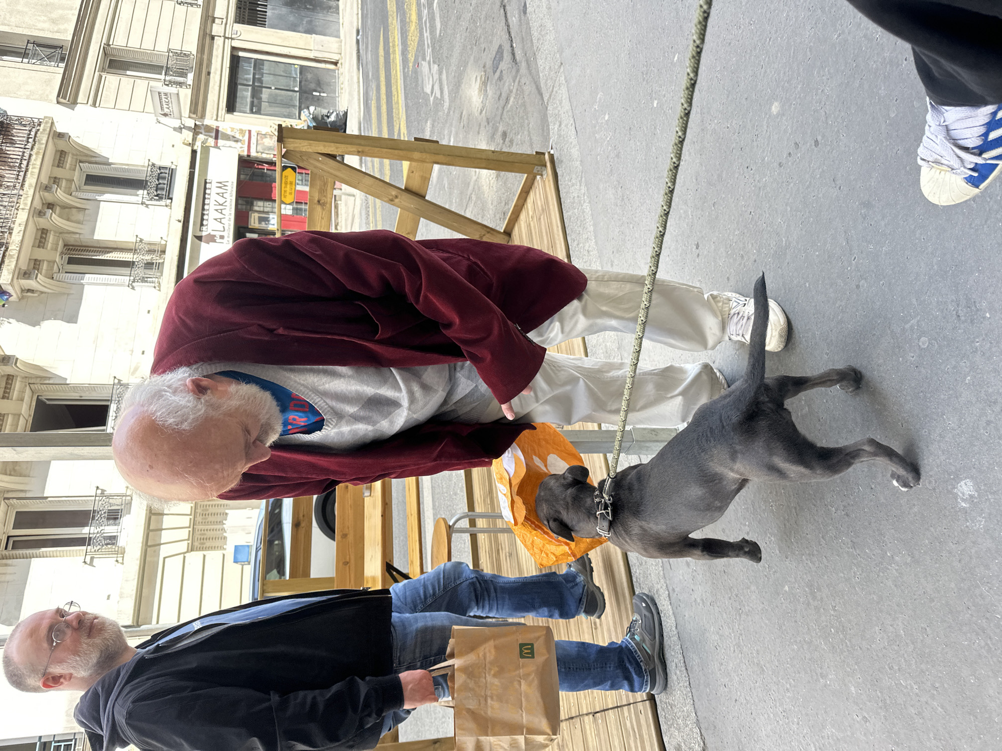 Ordinary morning street life captured in Paris neighborhood