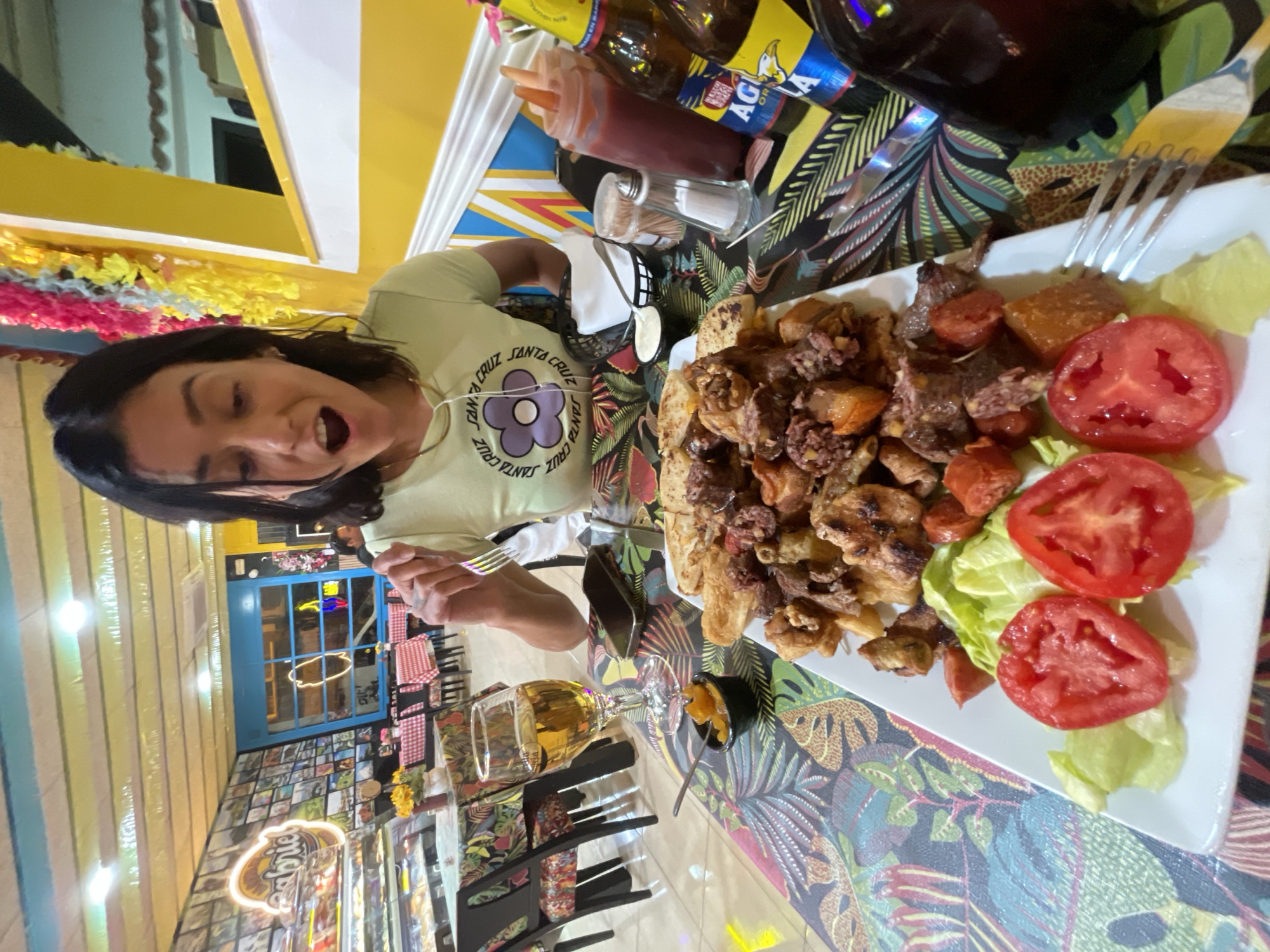 Woman documents dinner meal in L'Hospitalet de Llobregat