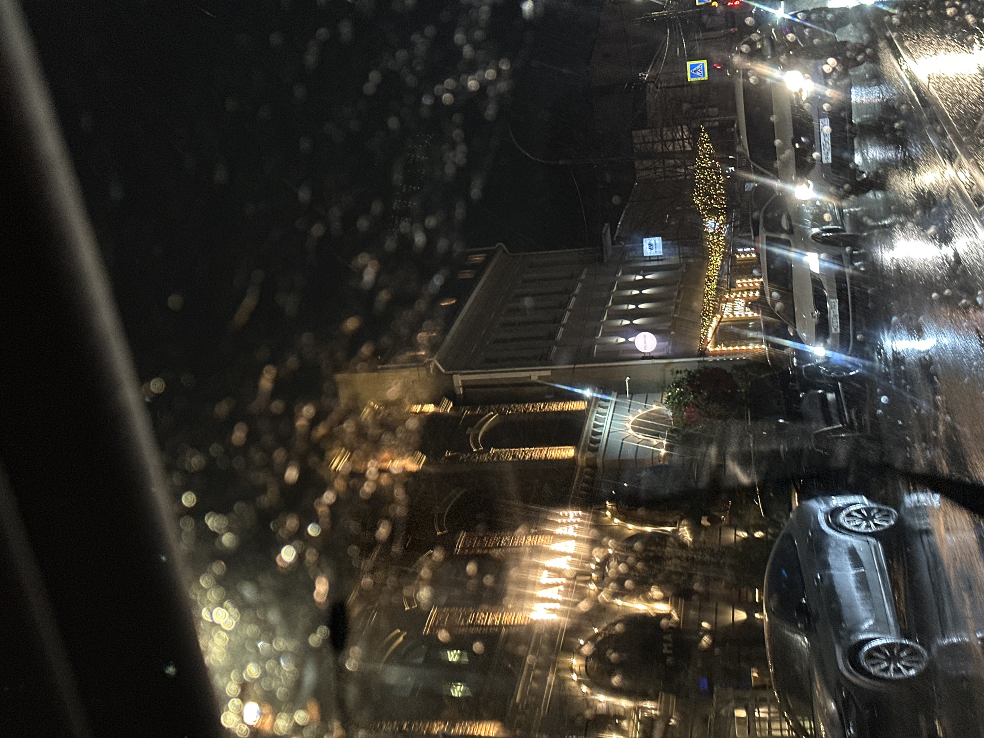 Illuminated building observed during rainy evening in Kuleshovka