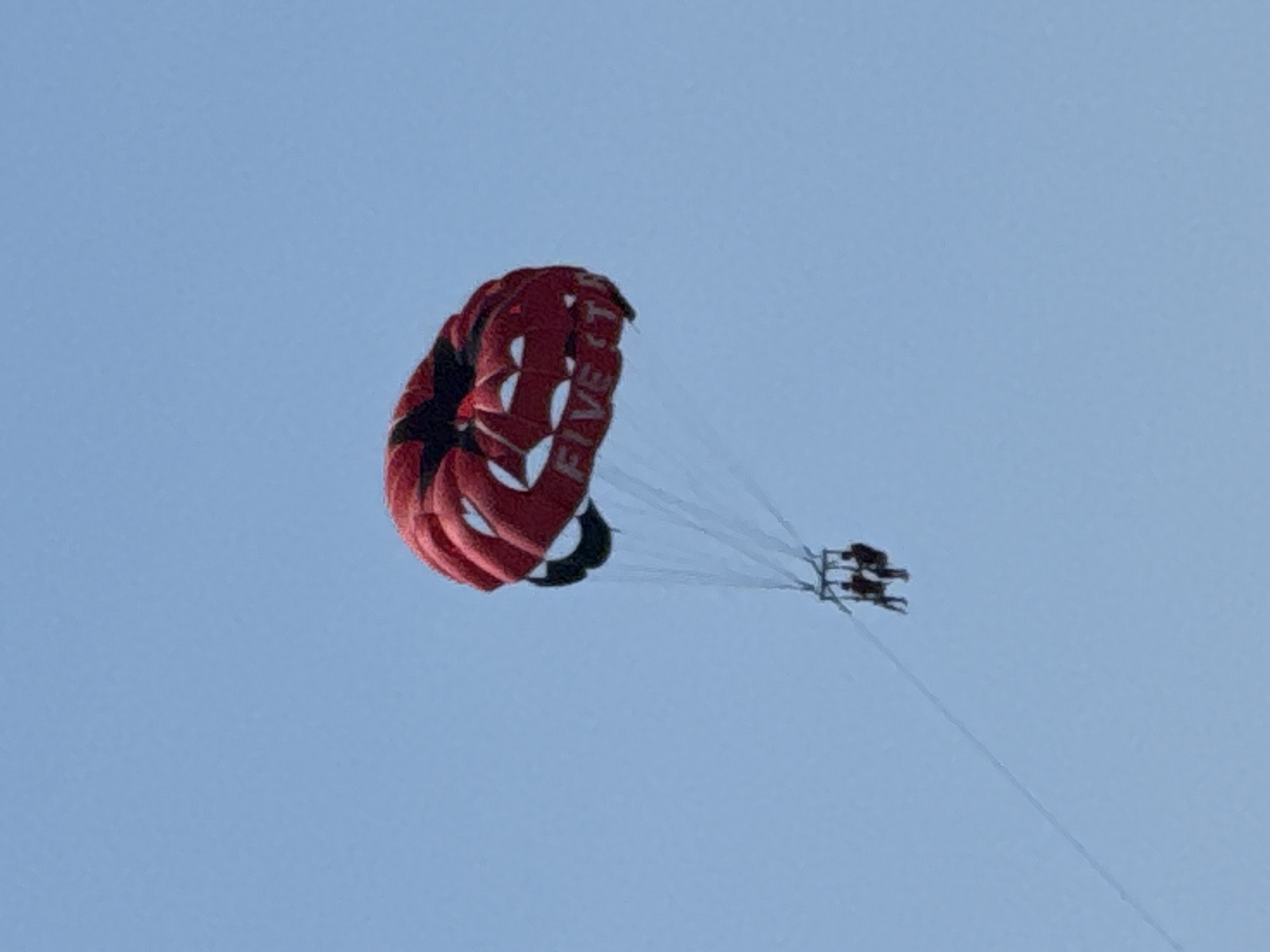 Tandem parasail ride over Aguadulce on a clear summer morning