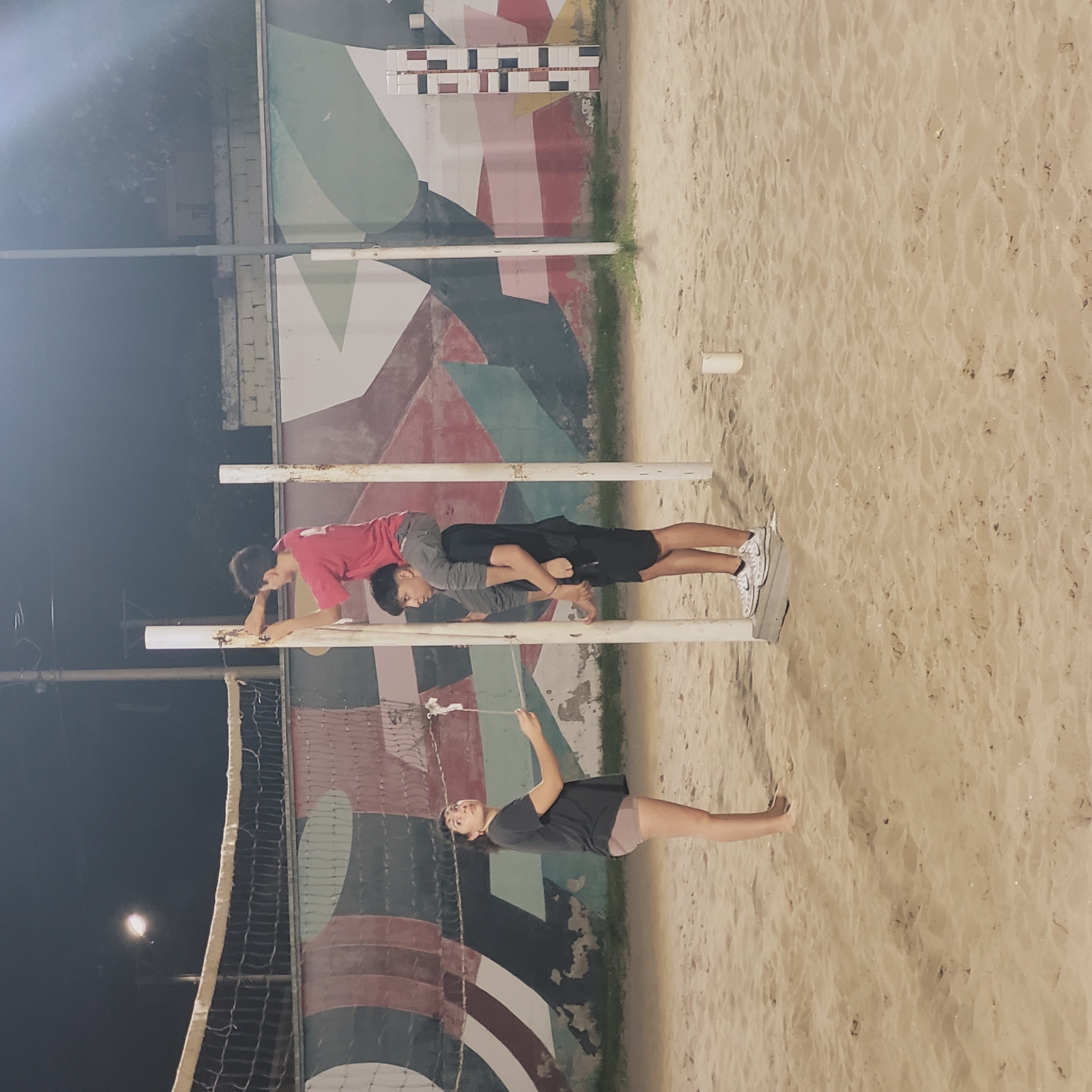 Nighttime beach volleyball court scene captured in Catamarca, Argentina